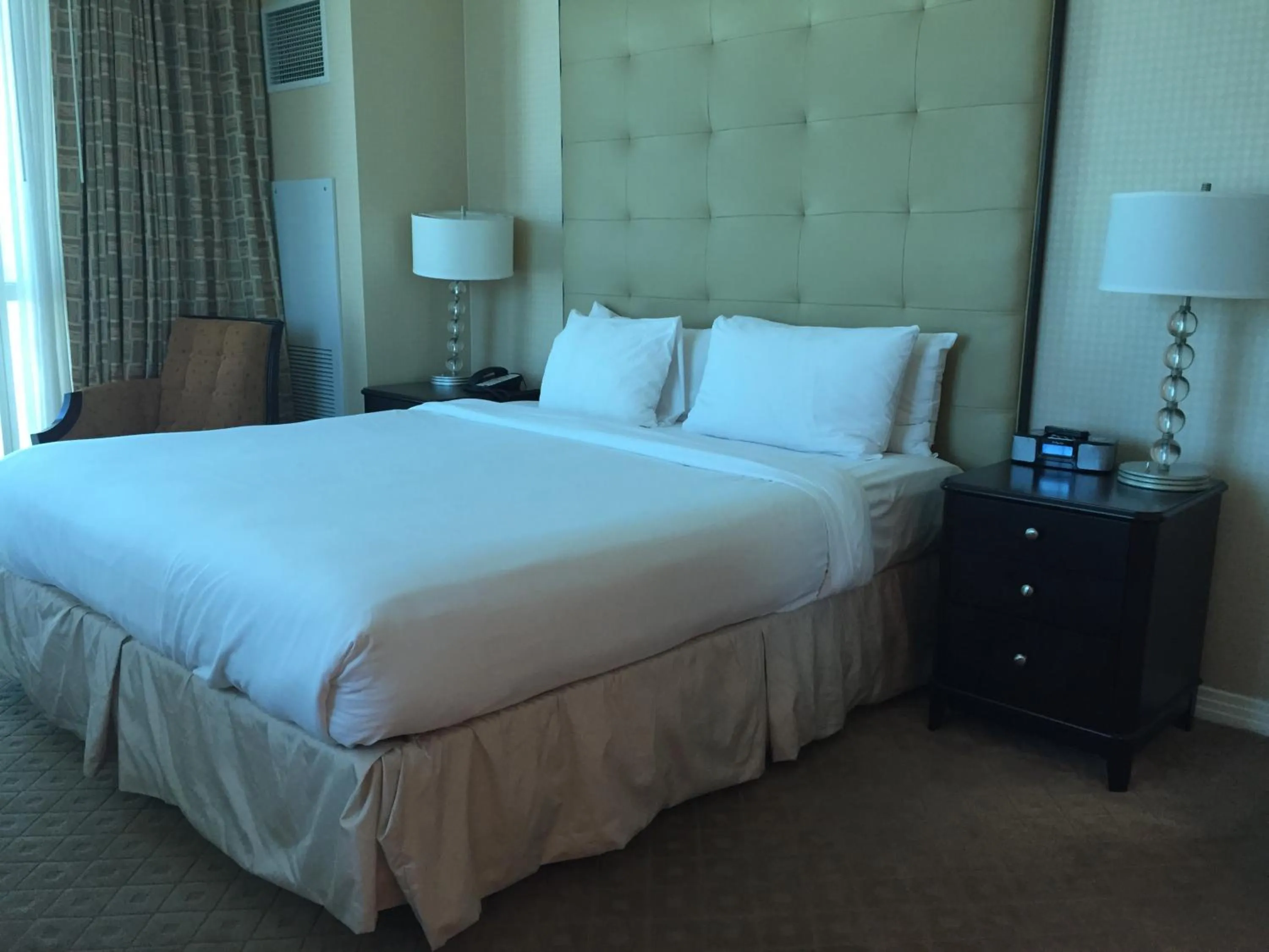 Bed in True 1BR Balcony Suite with Strip View at MGM Signature