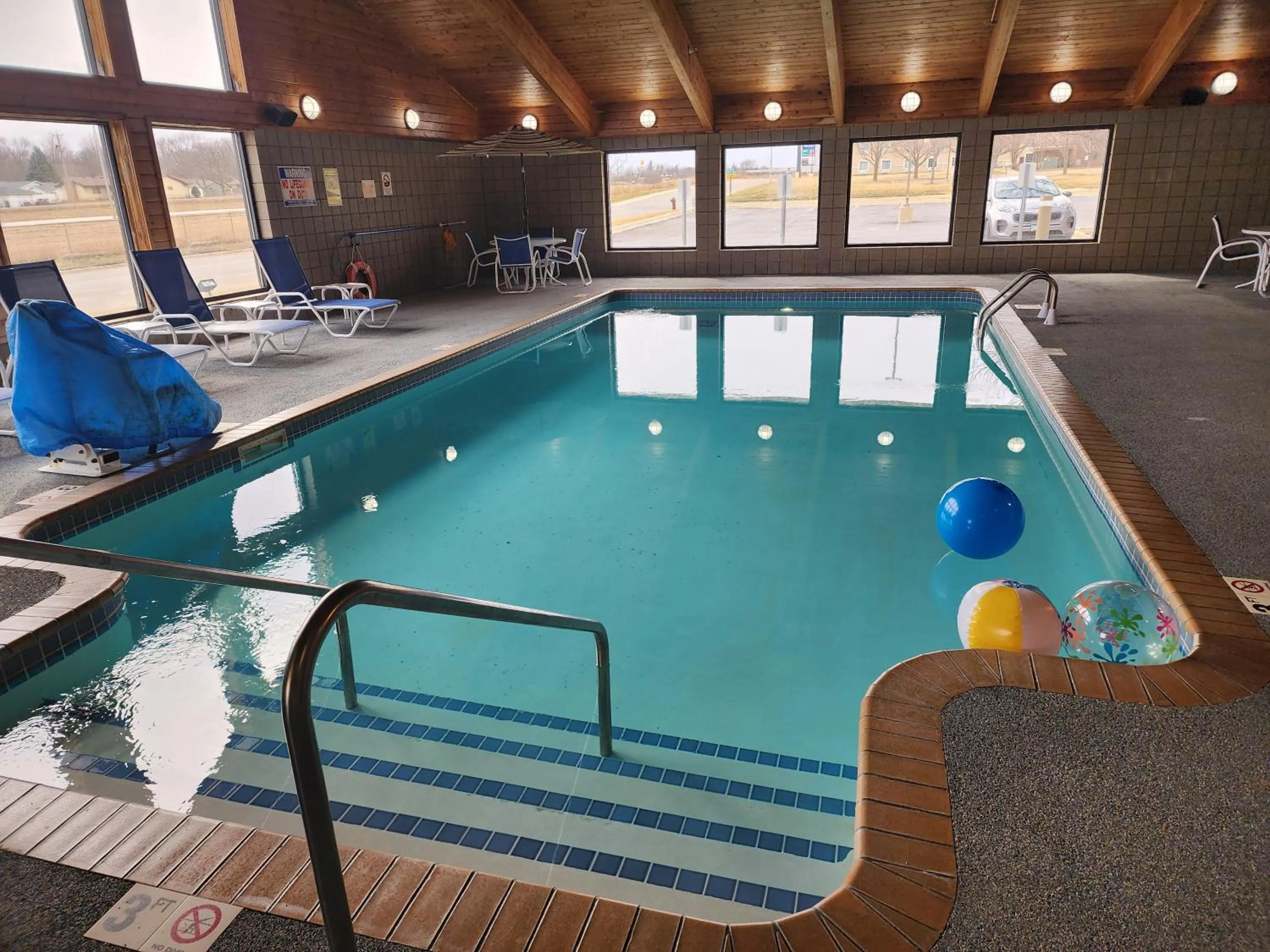 Swimming pool in AmericInn by Wyndham Austin
