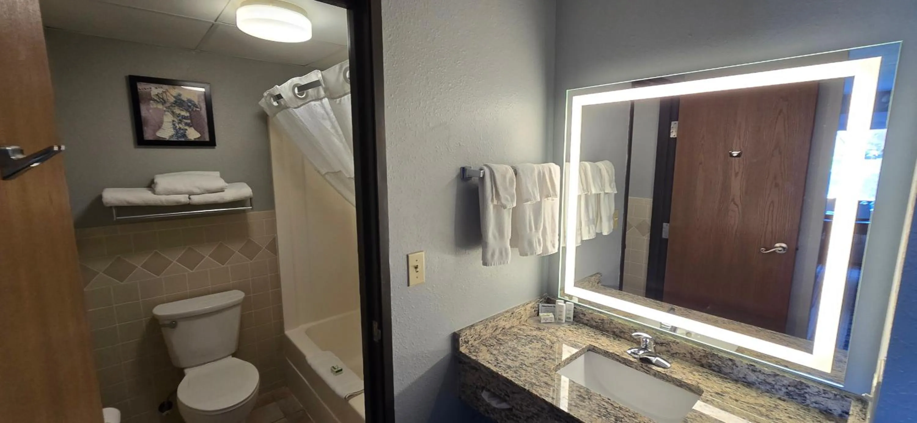 Shower in AmericInn by Wyndham Austin