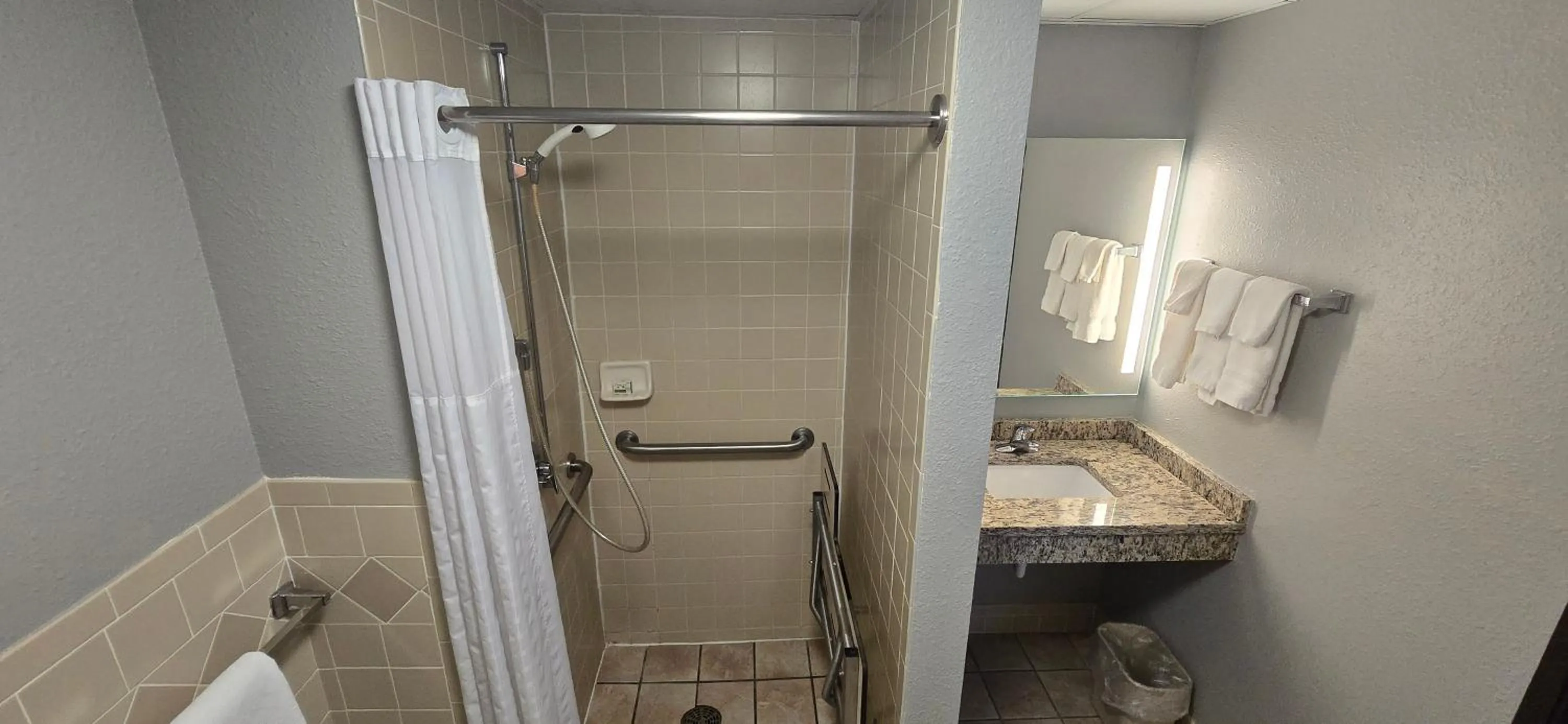 Shower in AmericInn by Wyndham Austin