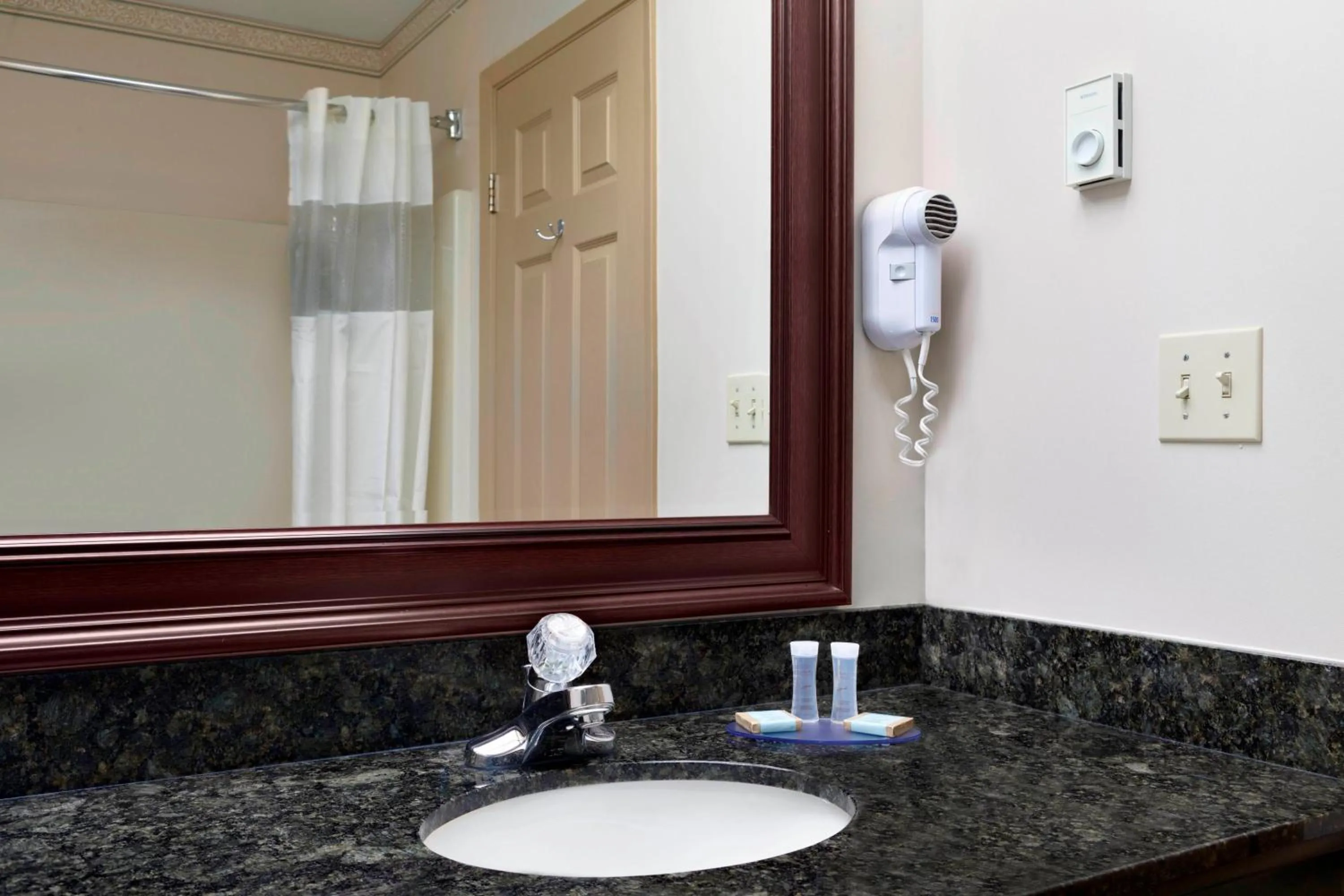 Bathroom in Days Inn & Suites by Wyndham Sault Ste. Marie ON