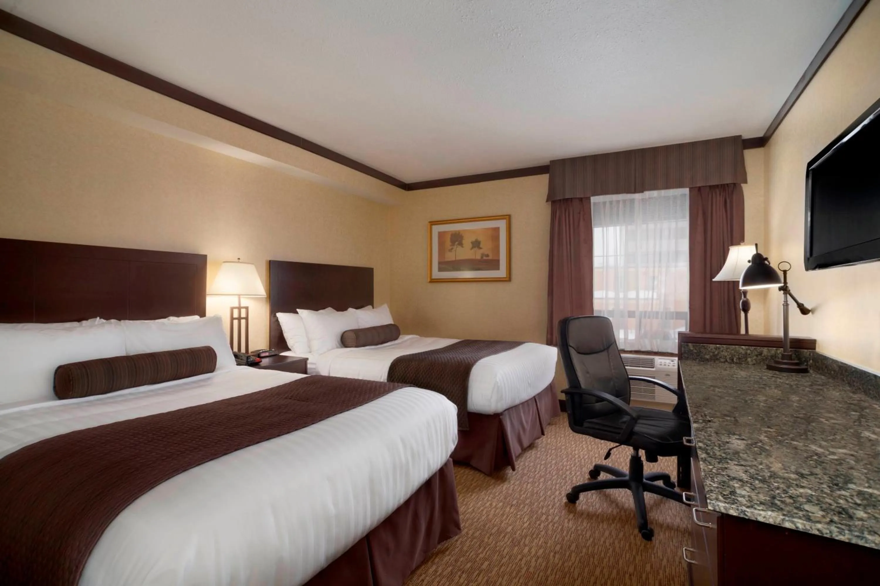 Photo of the whole room, Bed in Days Inn & Suites by Wyndham Sault Ste. Marie ON