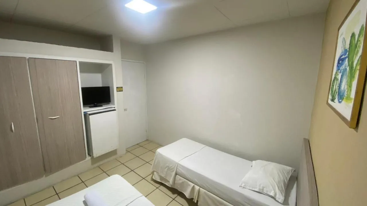 Bed in Center Plaza Hotel