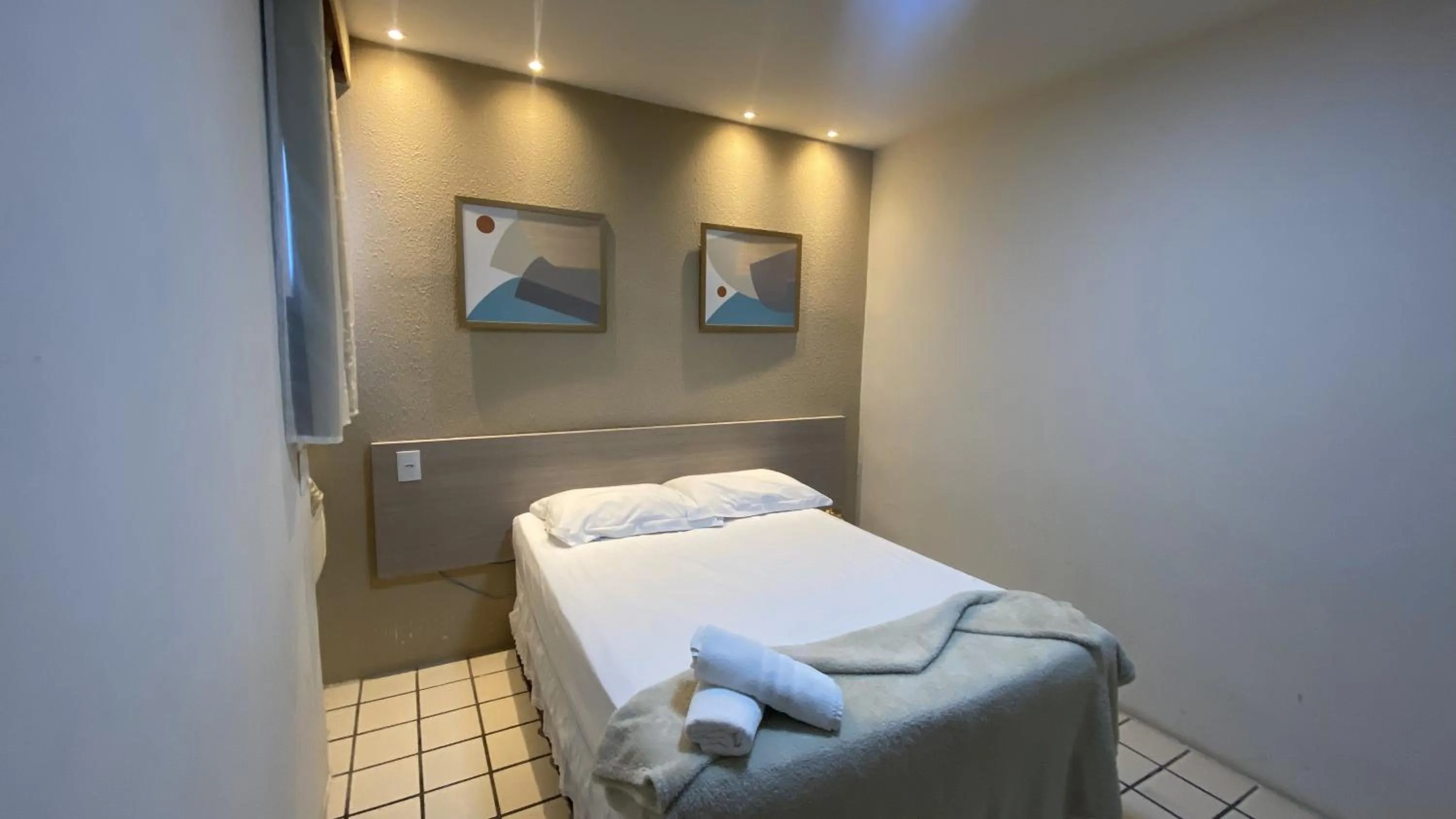 Bed in Center Plaza Hotel