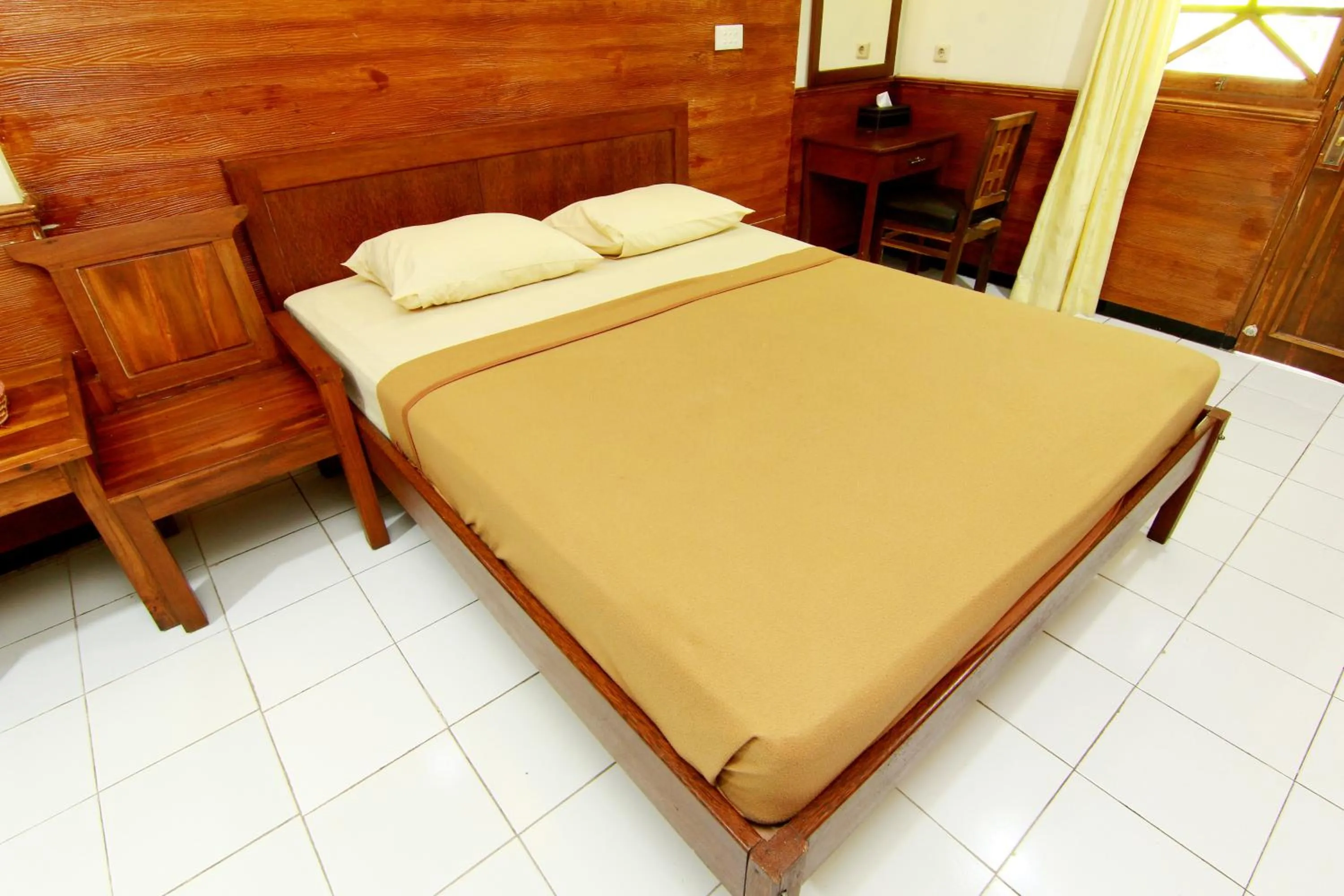 Bed in The Soemarsono Hotel