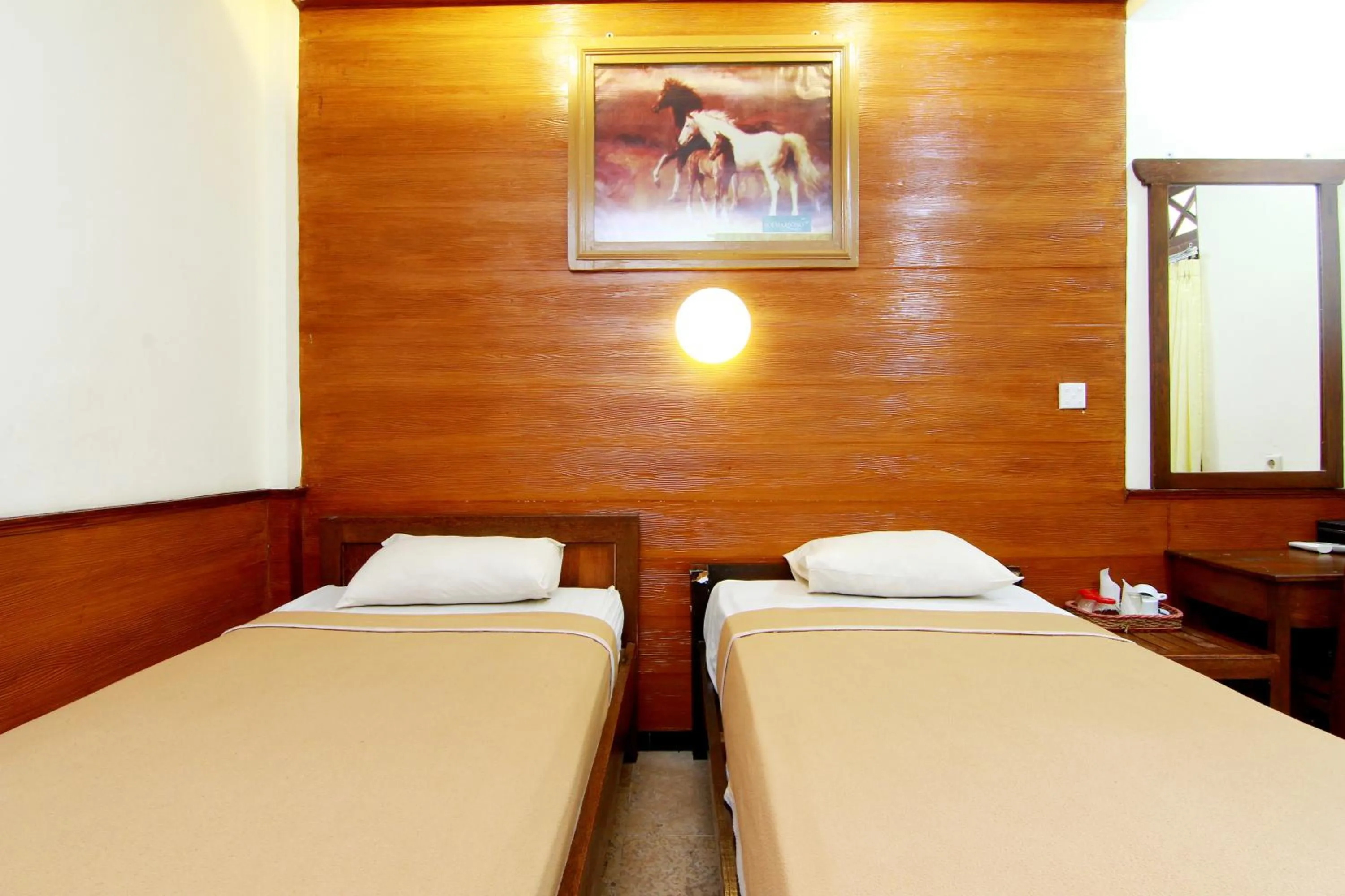 Bed in The Soemarsono Hotel