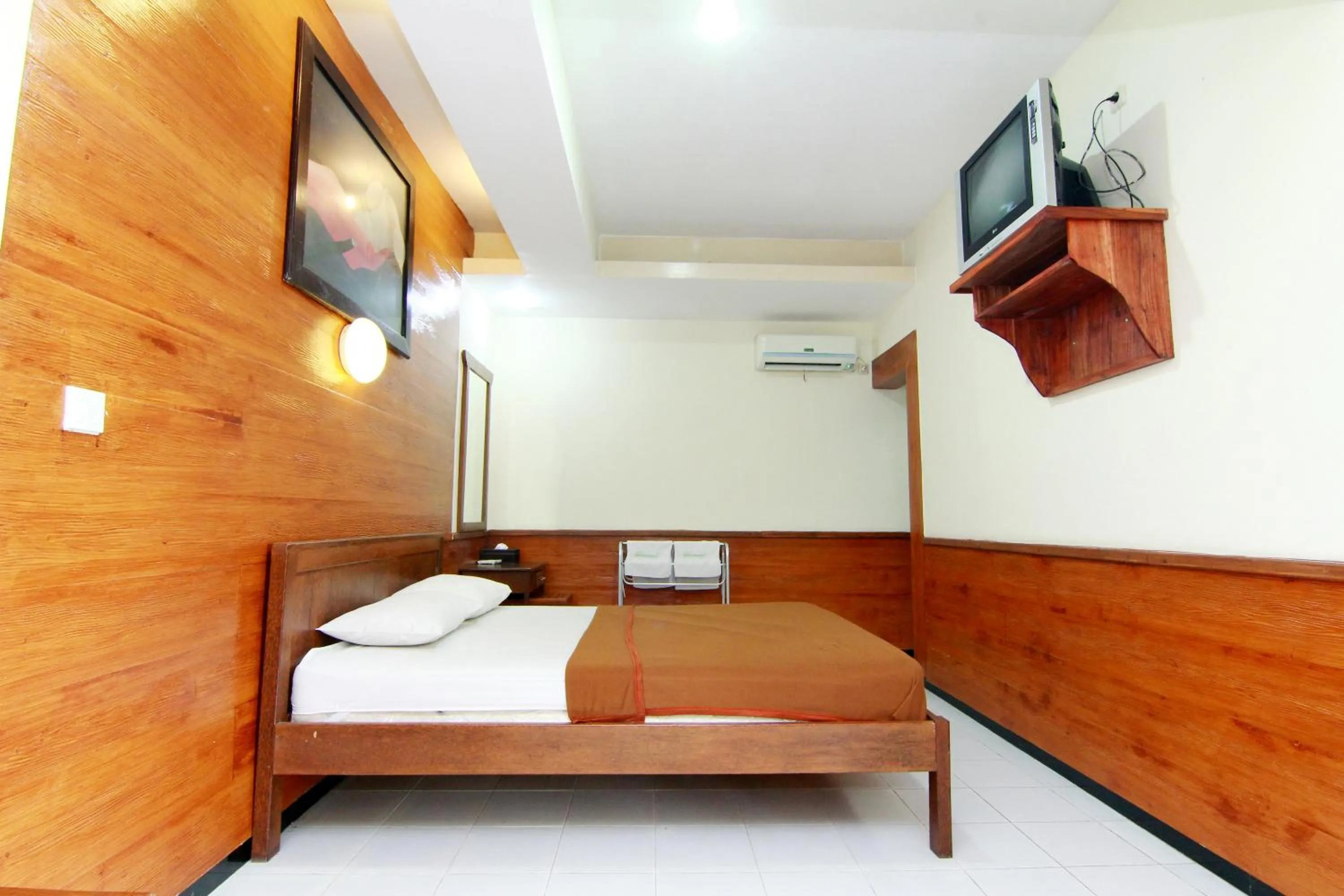 Bed in The Soemarsono Hotel