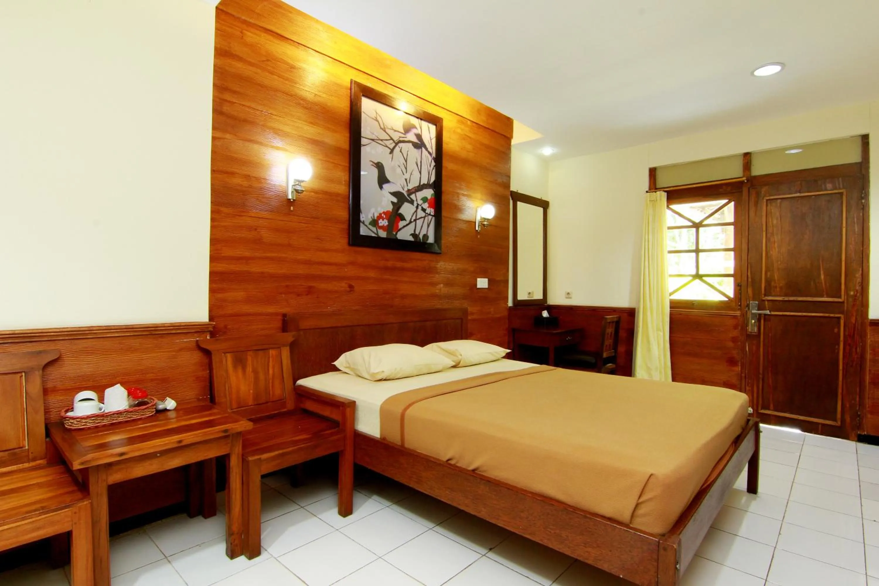 Bed in The Soemarsono Hotel