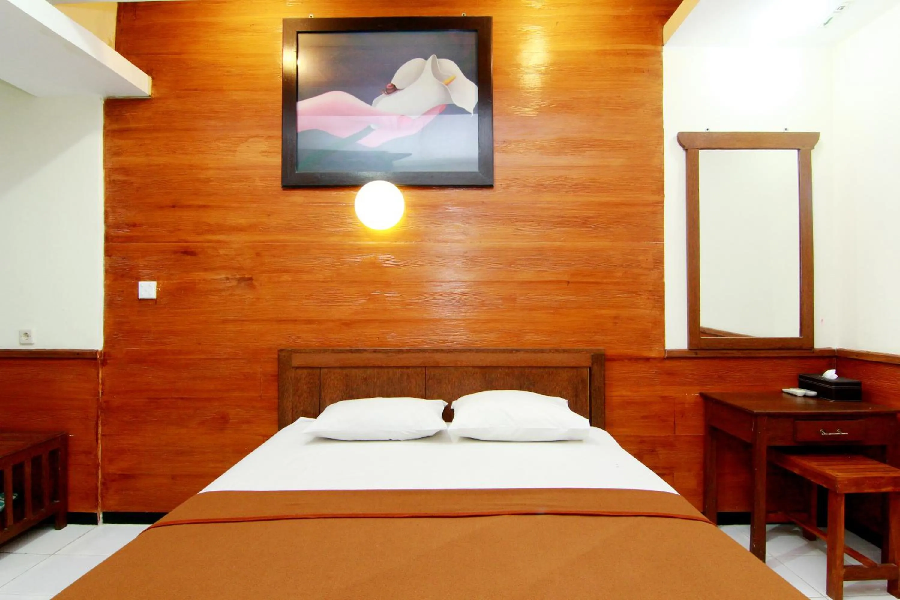 Bed in The Soemarsono Hotel