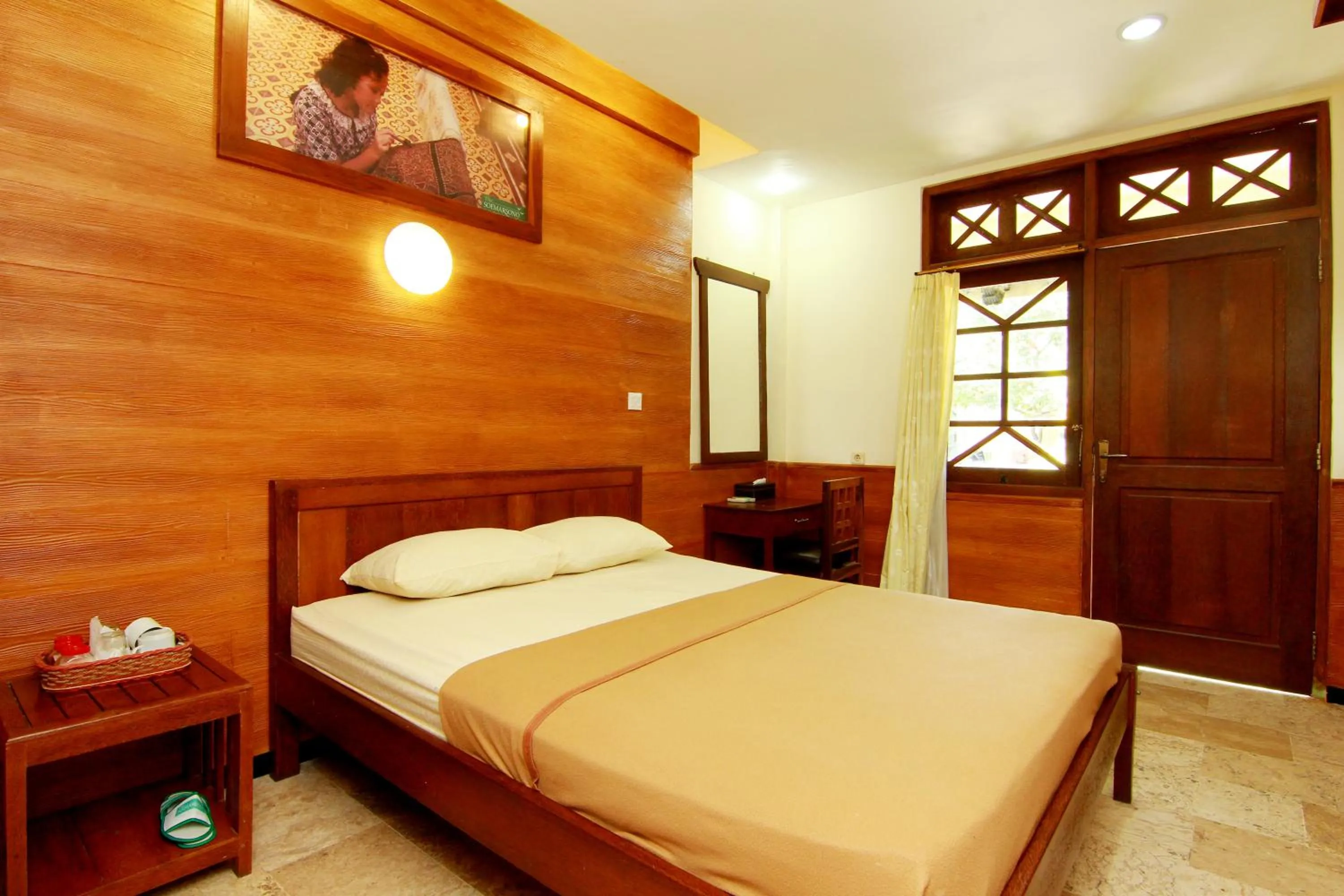 Bed in The Soemarsono Hotel