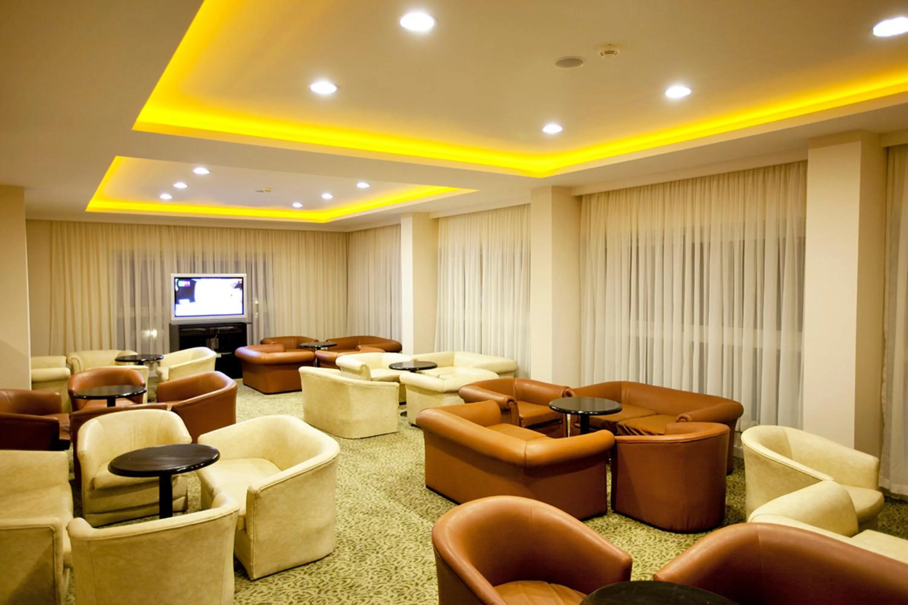 Lounge or bar in Marbel Hotel by PalmWings