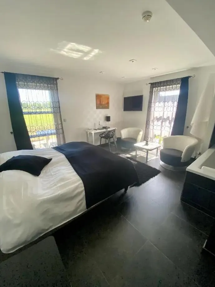 Bed in Hotel L'Ami du Chambertin