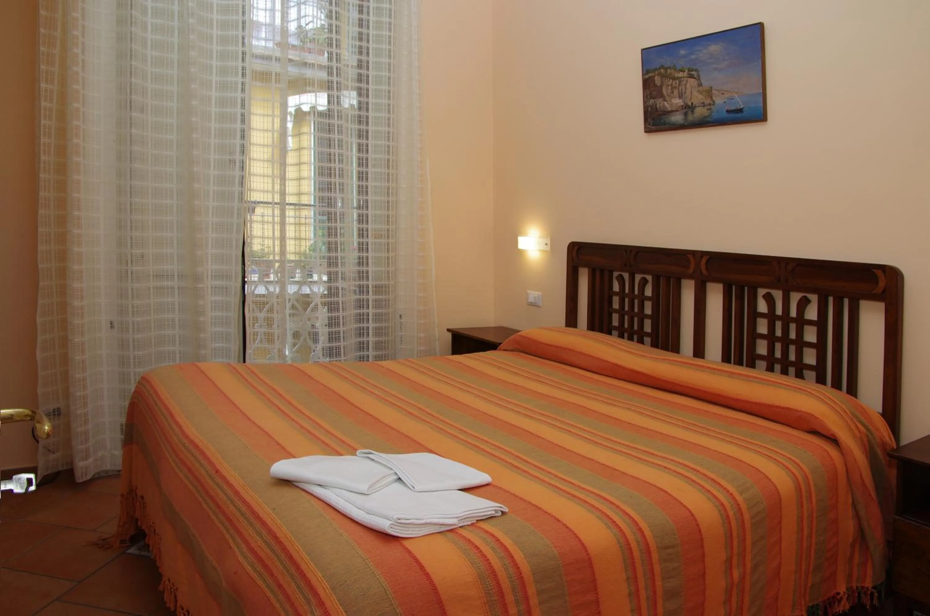 Bed in DolceVitaSorrento Guest House