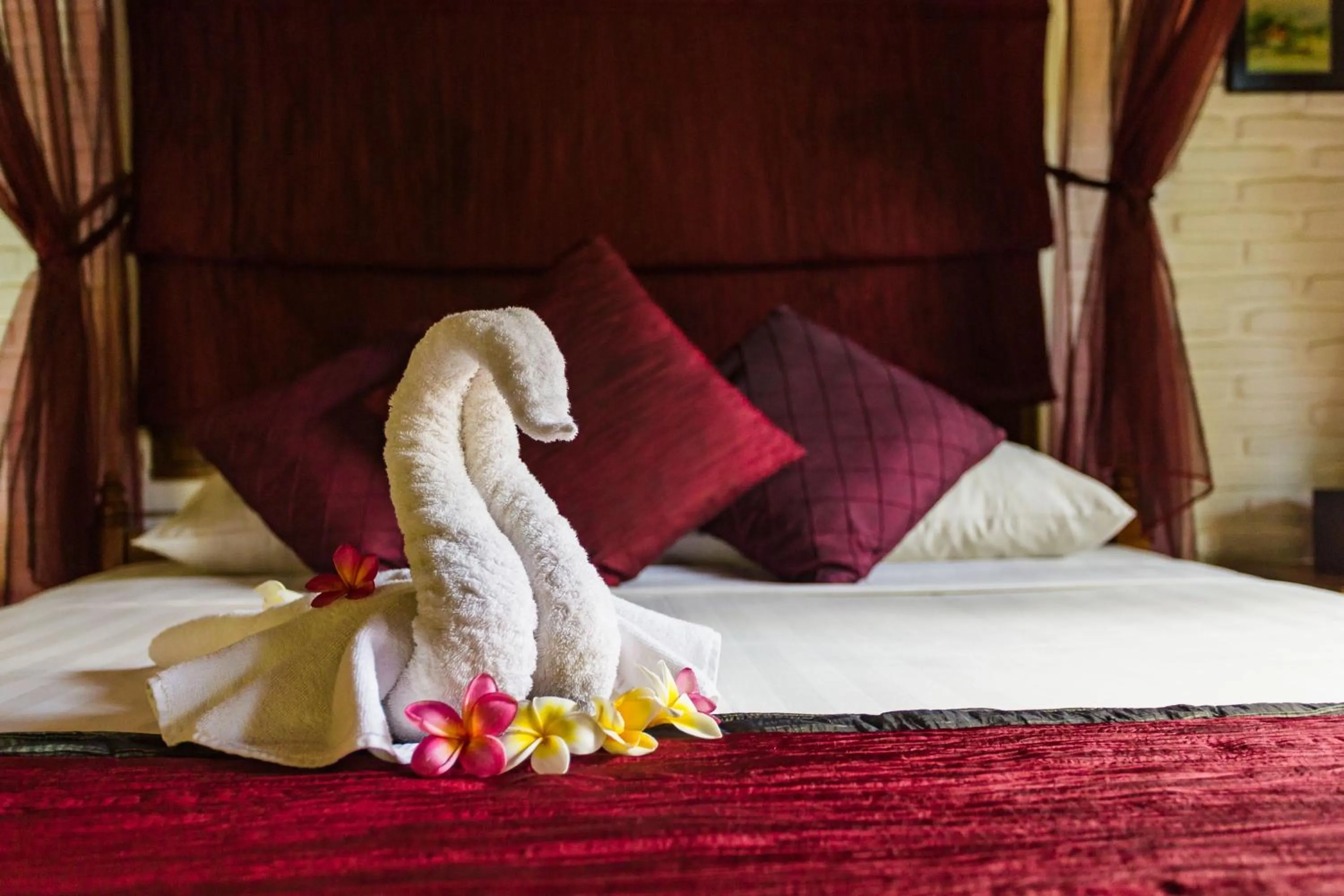 Bed in The Water Garden Hotel