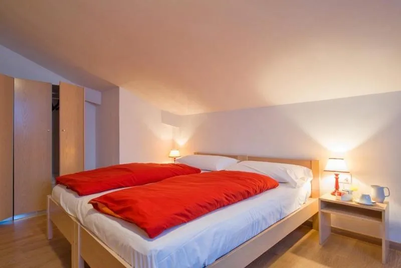 Photo of the whole room, Bed in Hotel Regina Delle Dolomiti