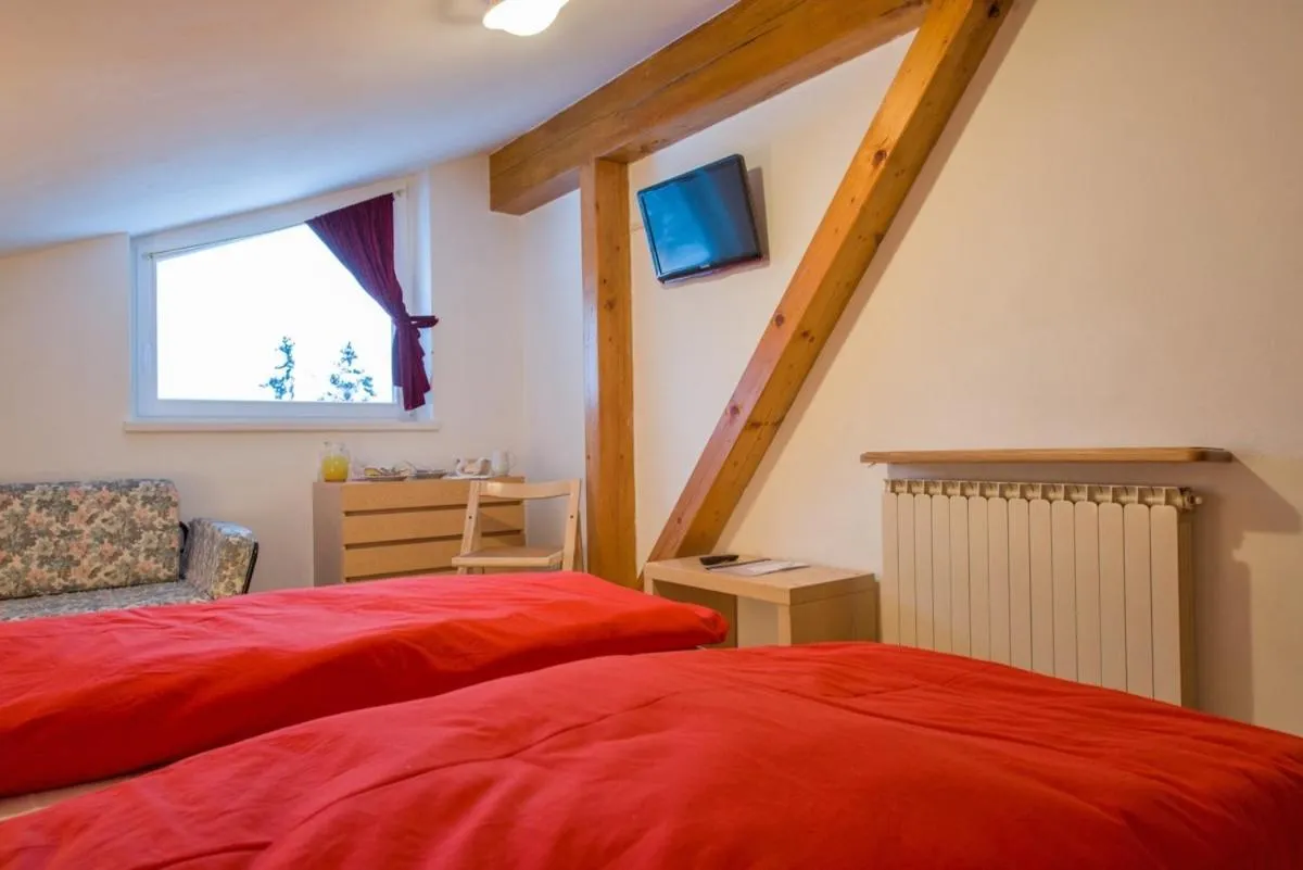 Photo of the whole room, Bed in Hotel Regina Delle Dolomiti