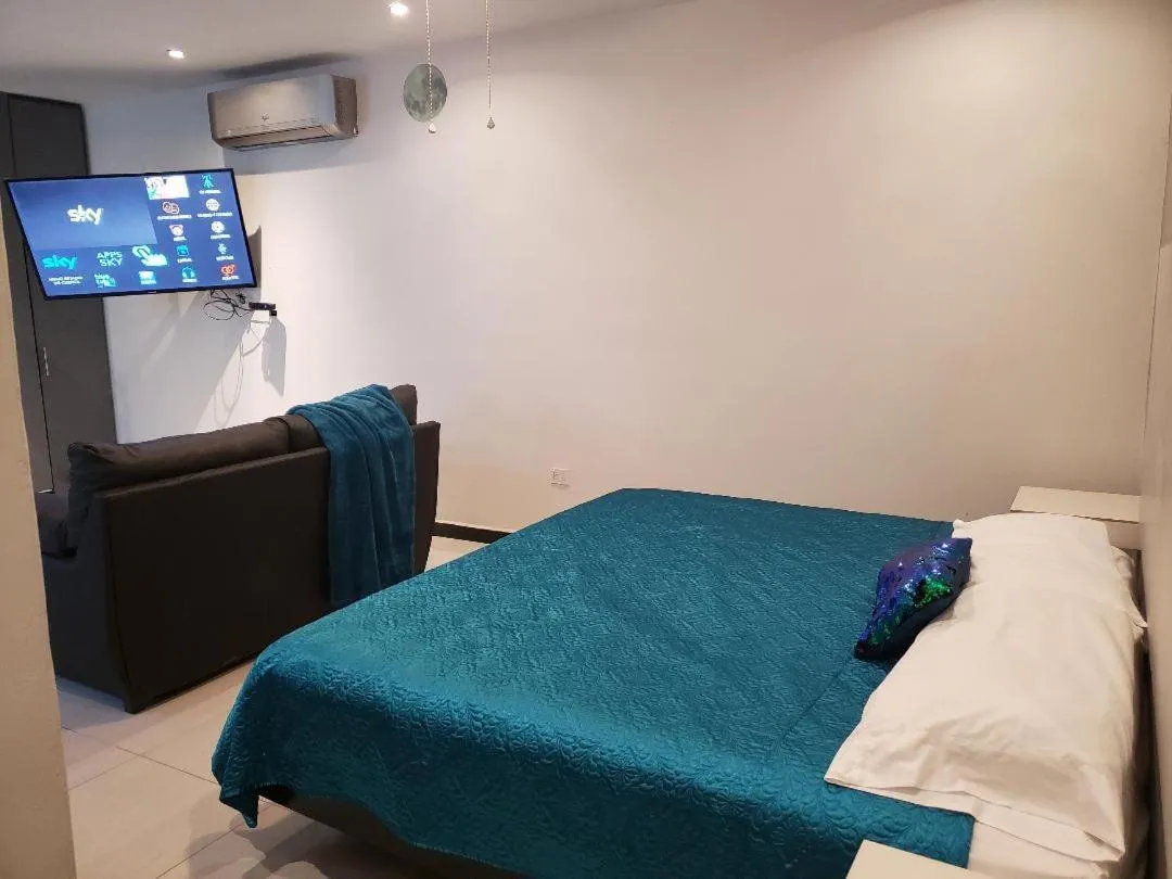 Bed in Privatto Suites