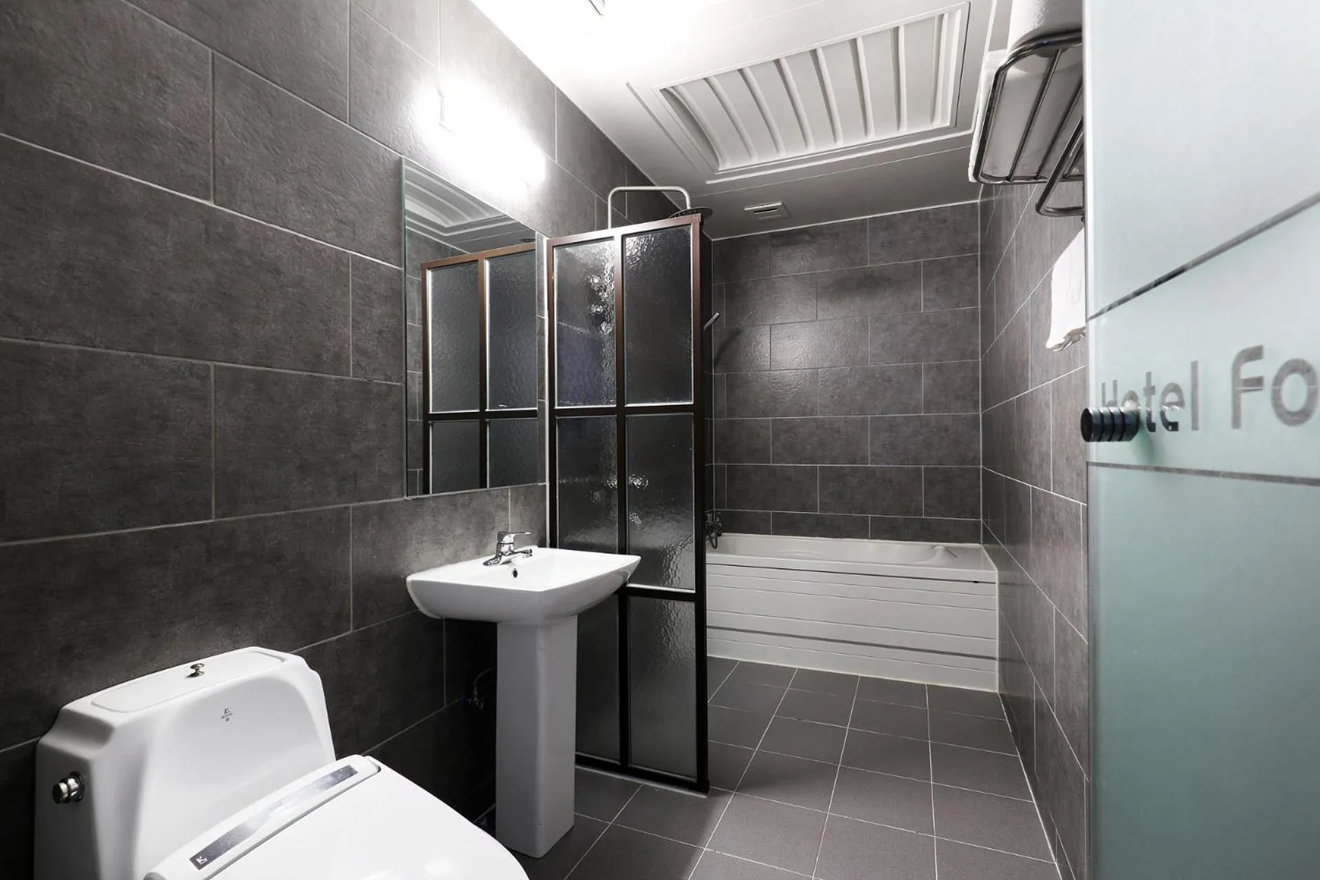 Toilet in BOLTON Hotel