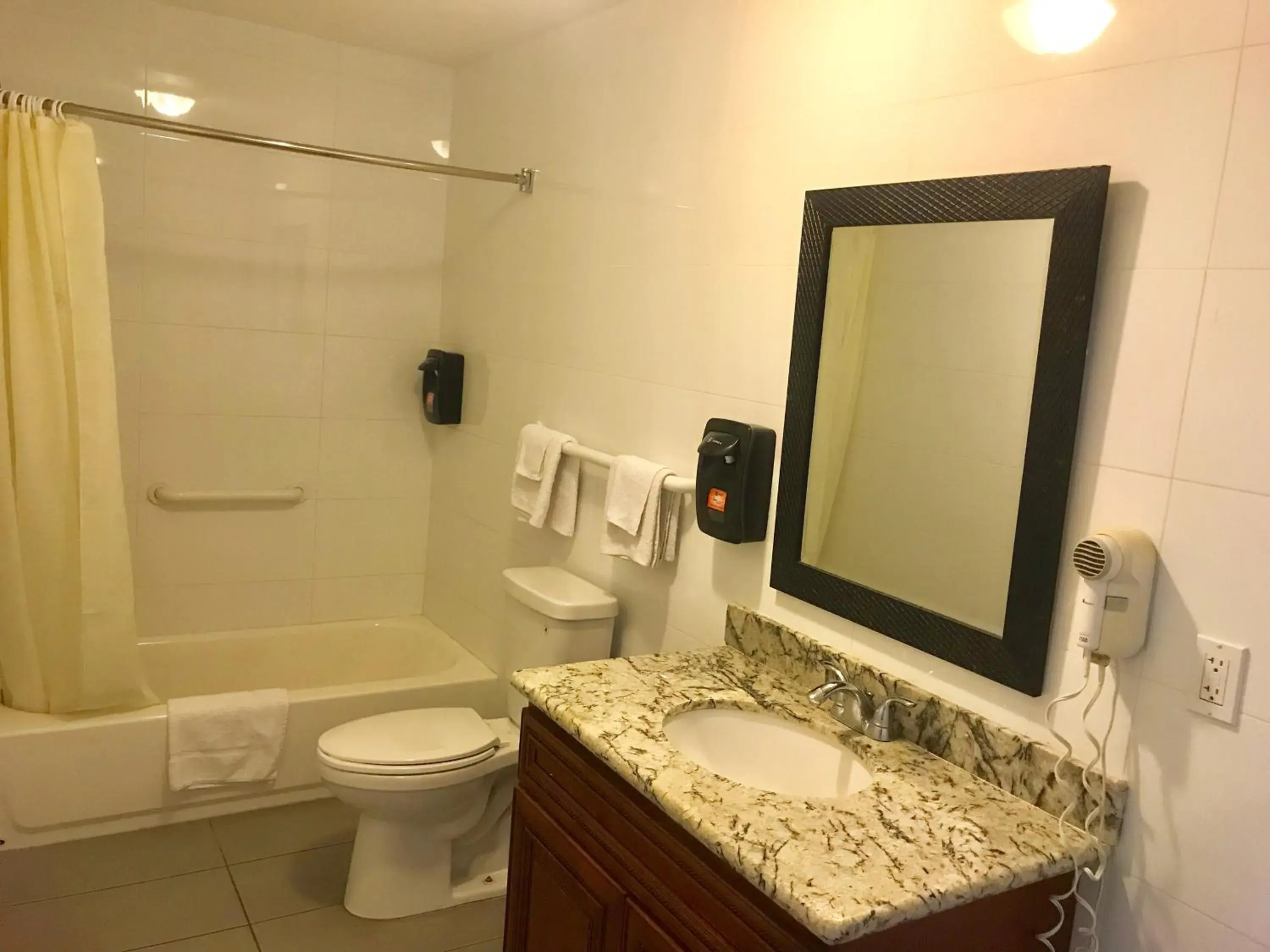 Bathroom in norwalk inn & suites