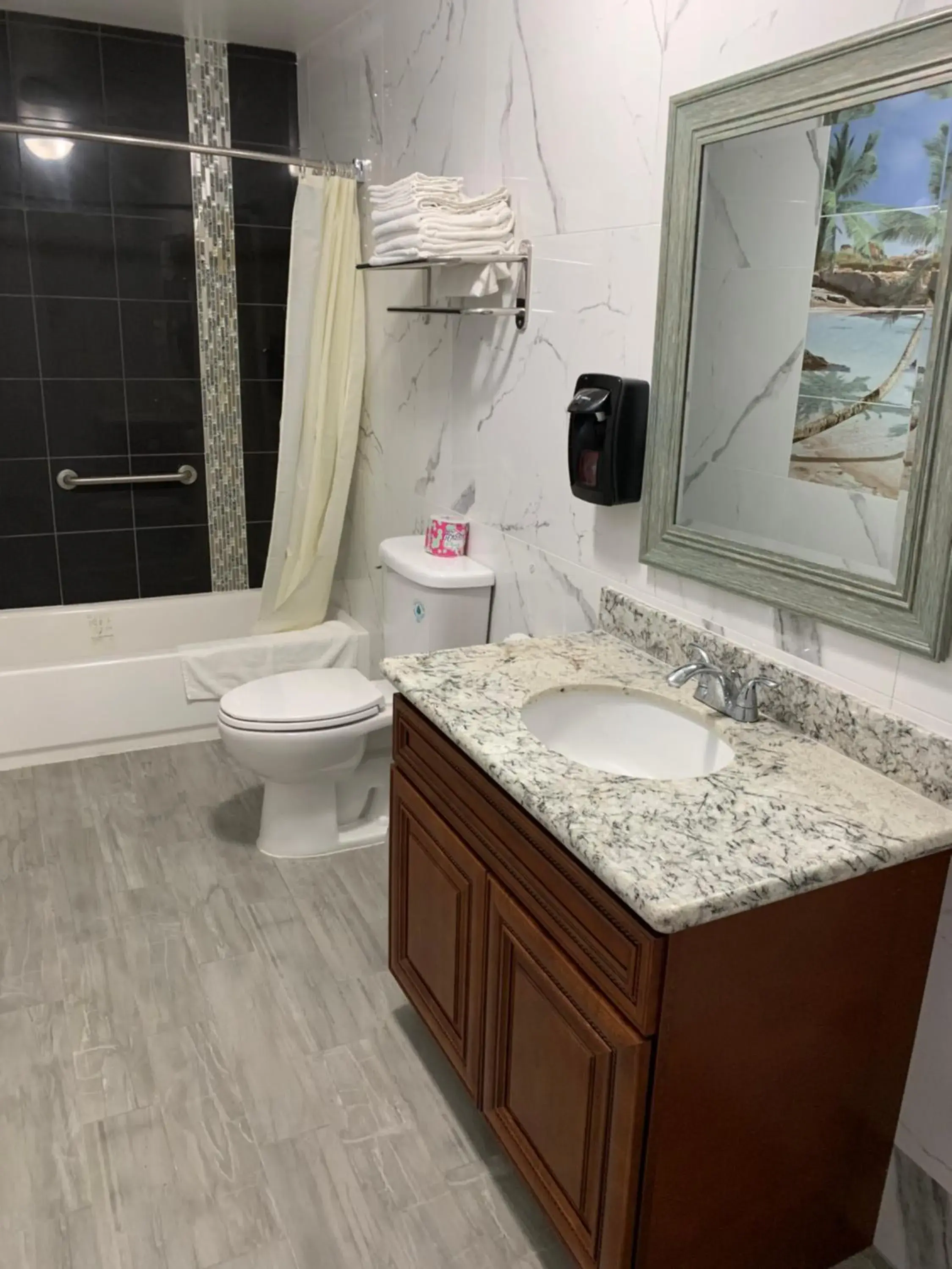 Bathroom in norwalk inn & suites