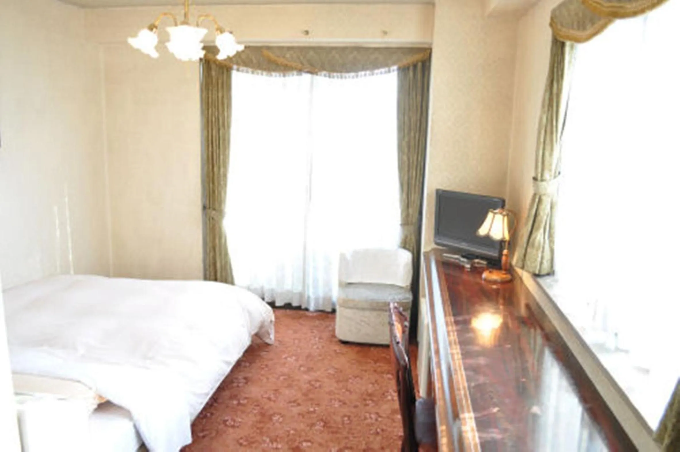 Bed in Green Hotel Rich Tokugawaen