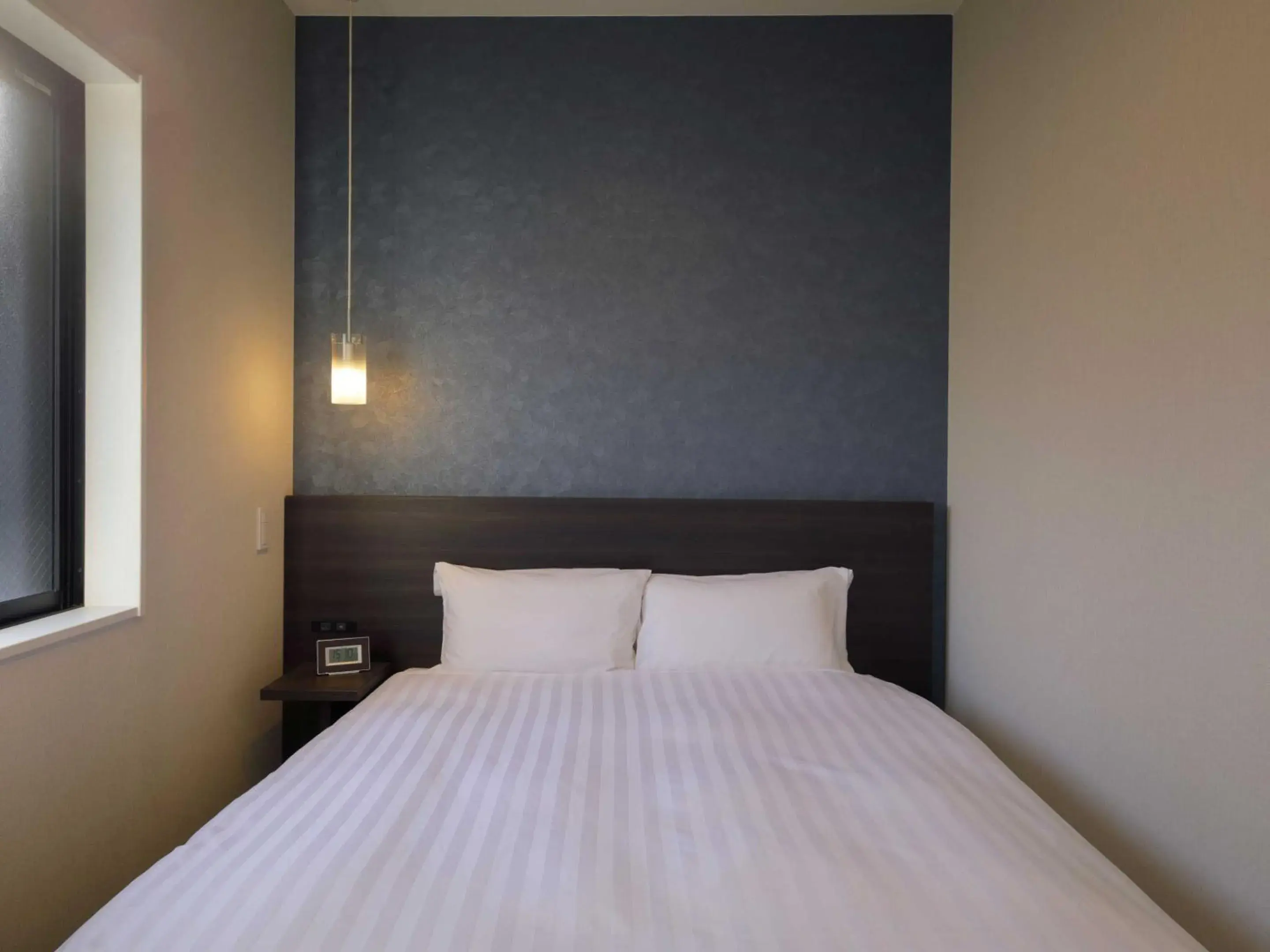 Bed in Smart Place Inn Kyoto Shijo Omiya Station Bed in Smart Place Inn Kyoto Shijo Omiya Station