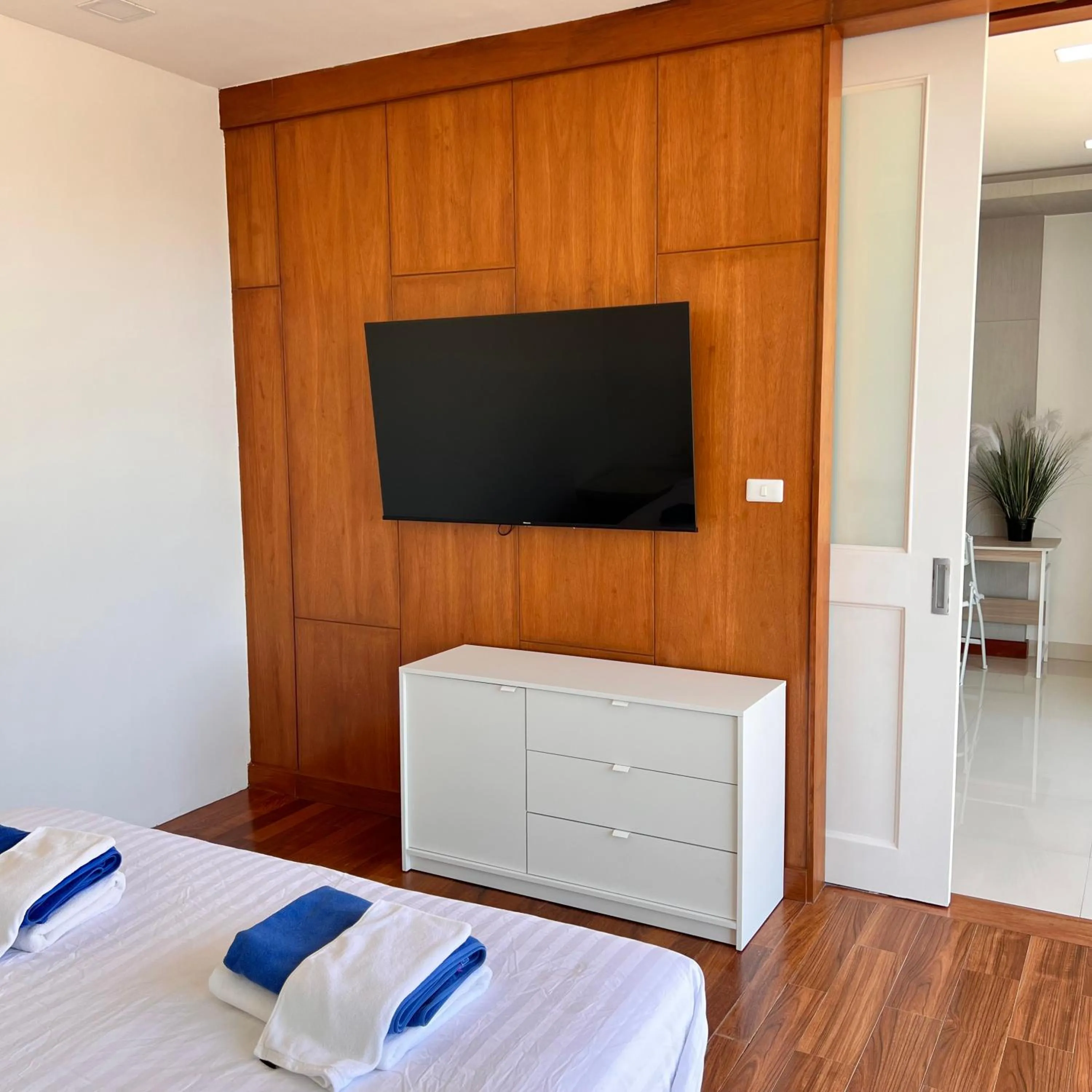 Communal lounge/ TV room, Bed in Q Kata Residence