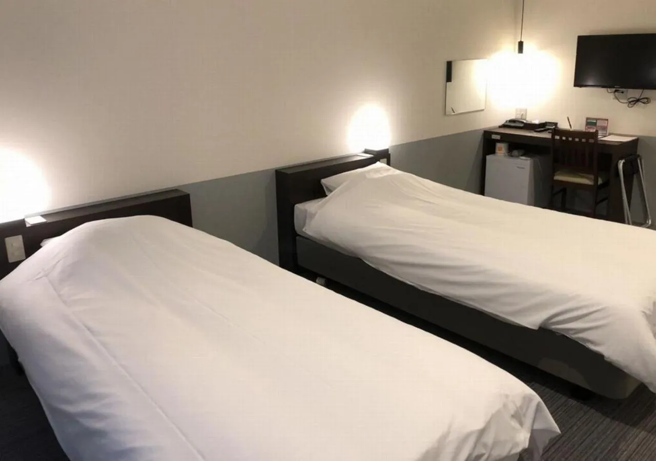 Bed in Hotel Taiyo Nouen Furumitsu