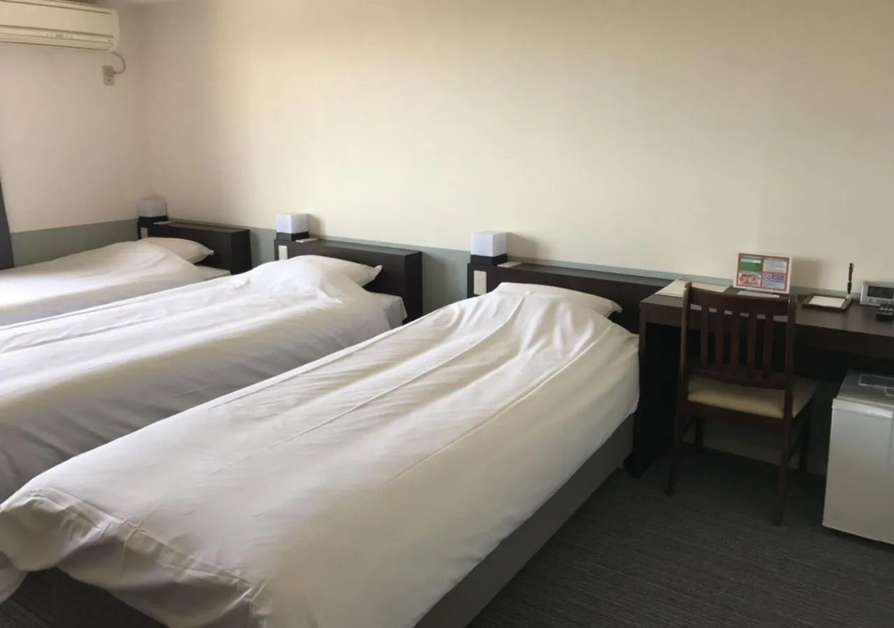 Bed in Hotel Taiyo Nouen Furumitsu