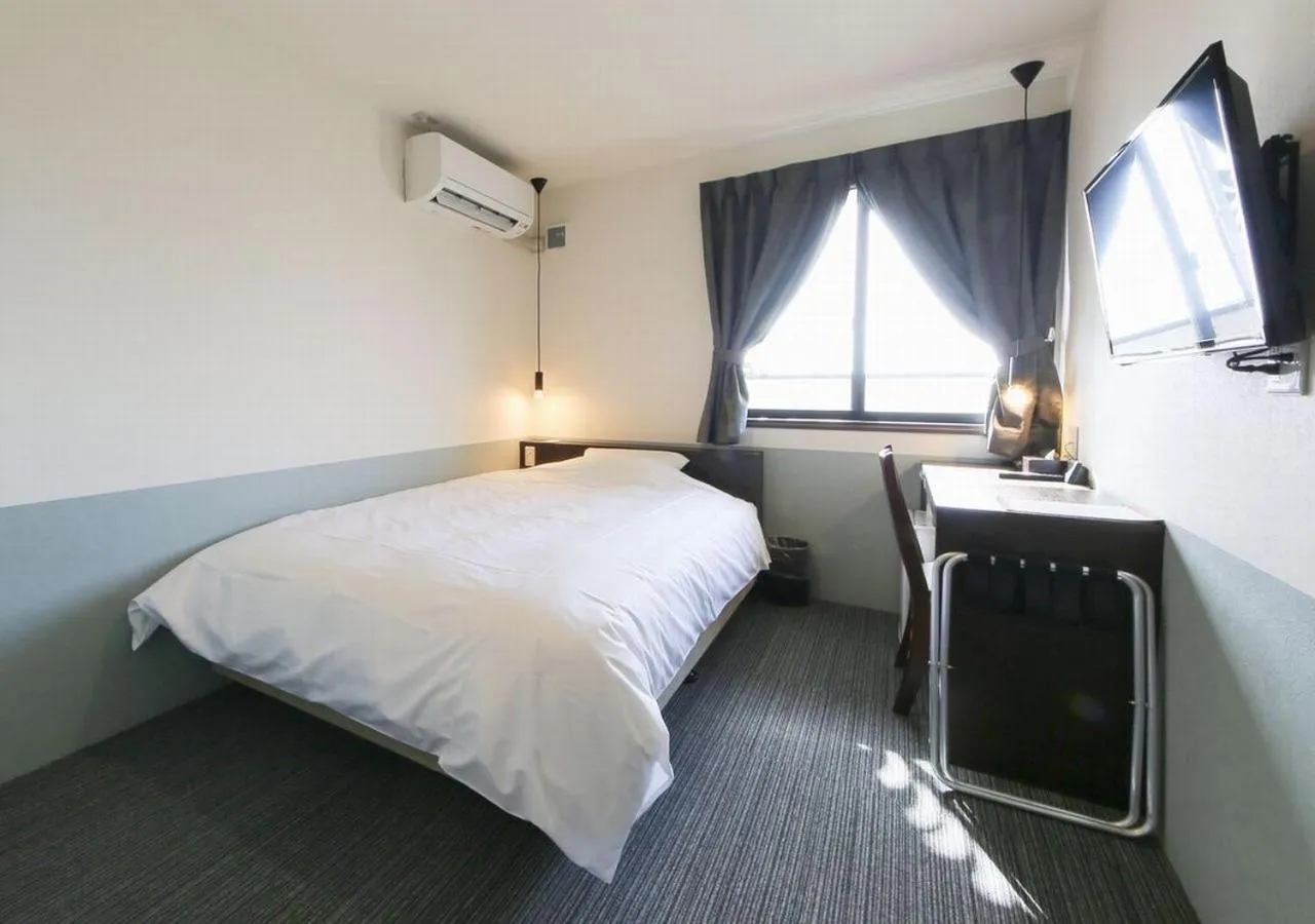 Bed in Hotel Taiyo Nouen Furumitsu