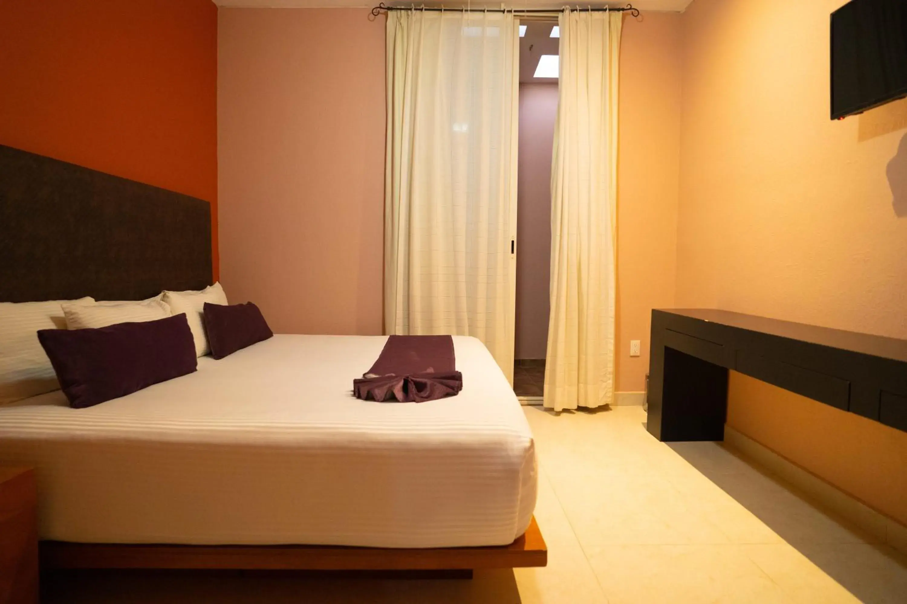 Bed in Hotel Suites Corazón Mexicano Bed in Hotel Suites Corazón Mexicano