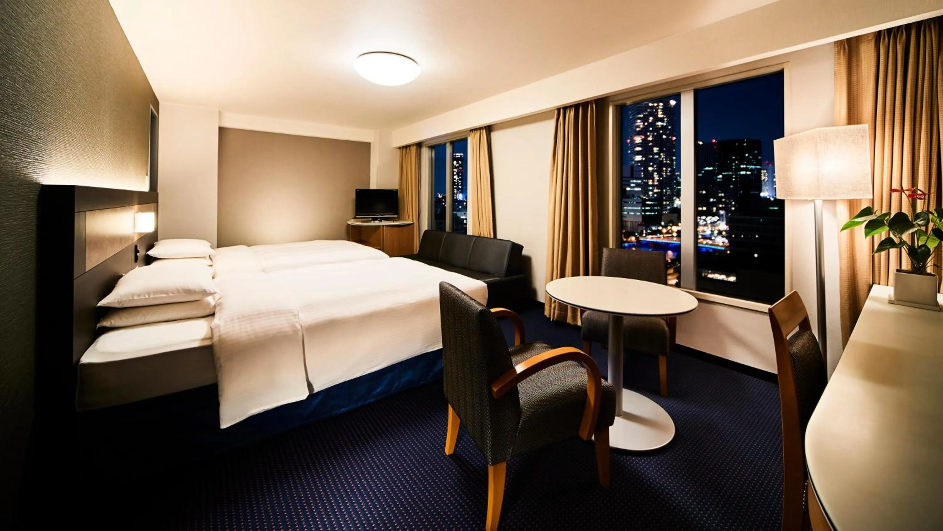 Photo of the whole room, Bed in RIHGA Royal Hotel Osaka, Vignette Collection by IHG