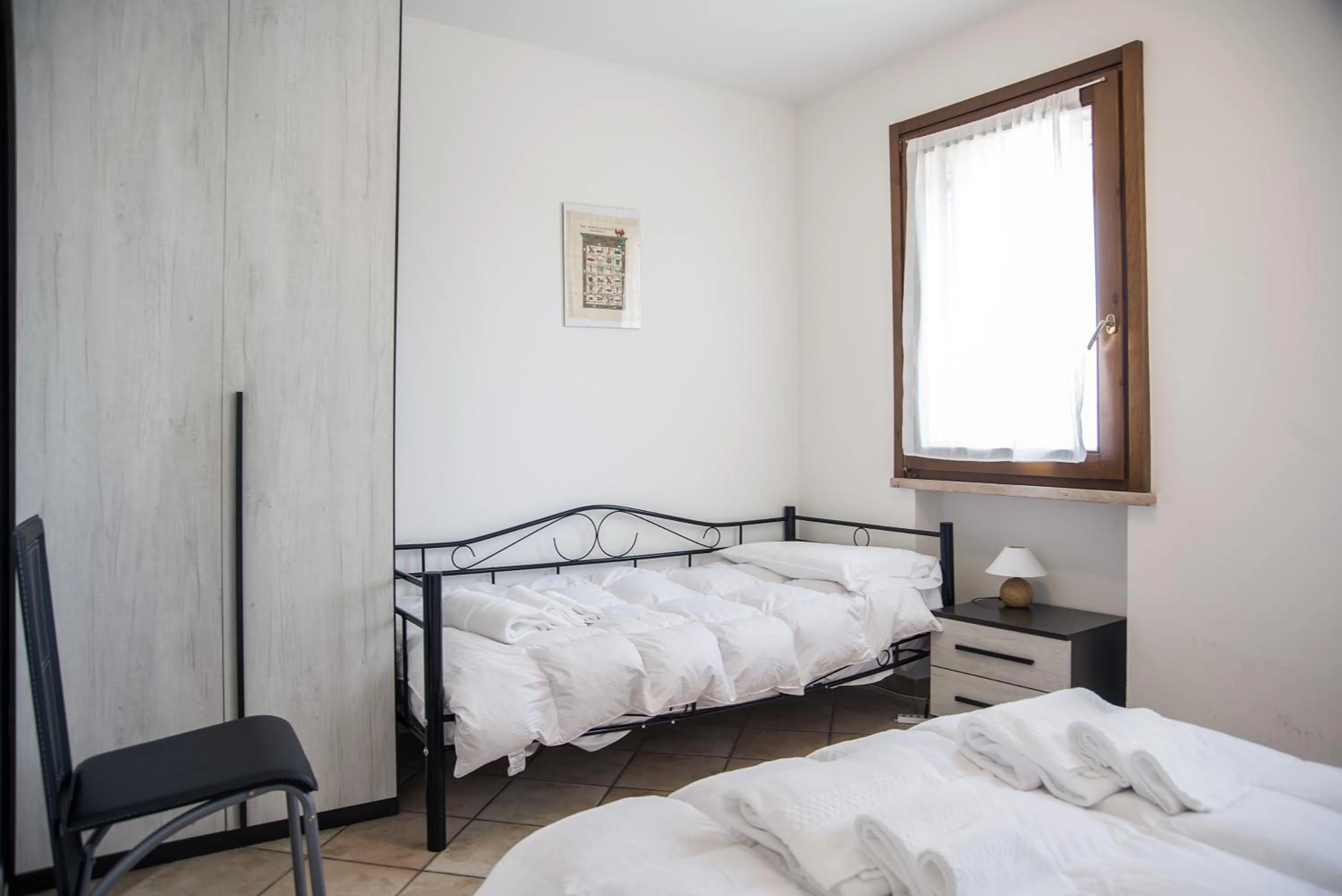 Photo of the whole room, Bed in Residenza Meeting