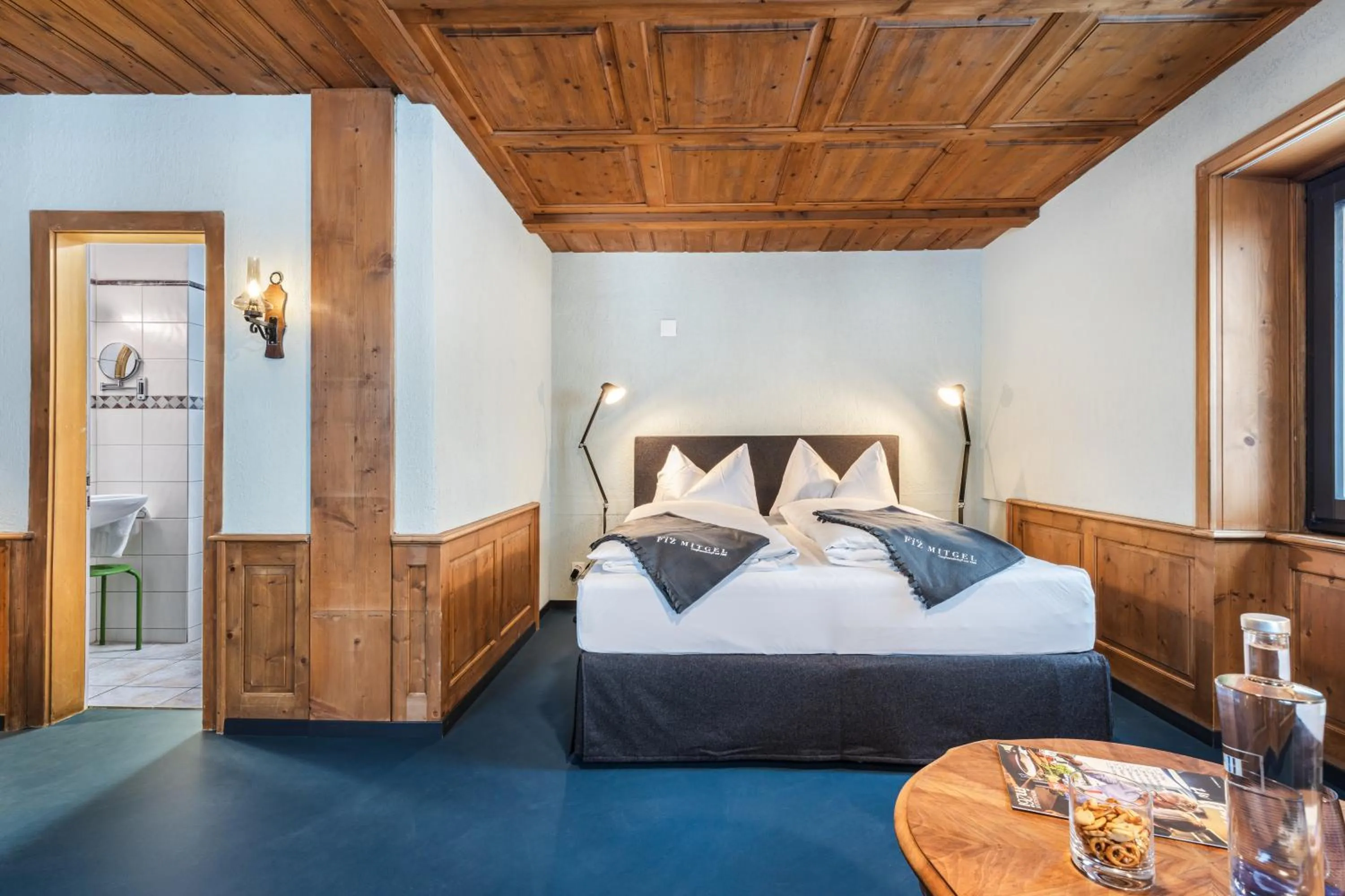 Bed in Hotel Piz Mitgel