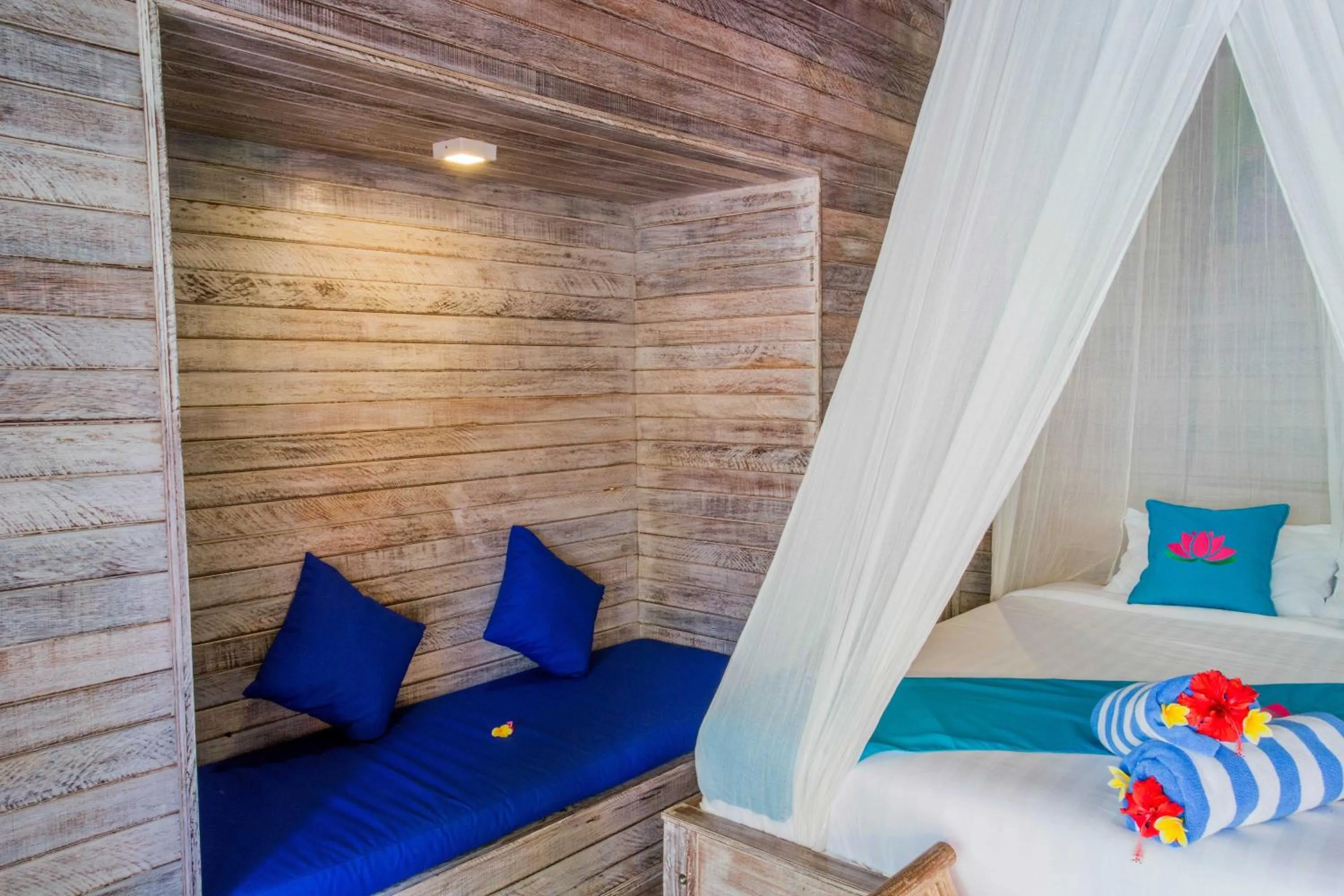 Photo of the whole room, Bed in Lotus Garden Huts