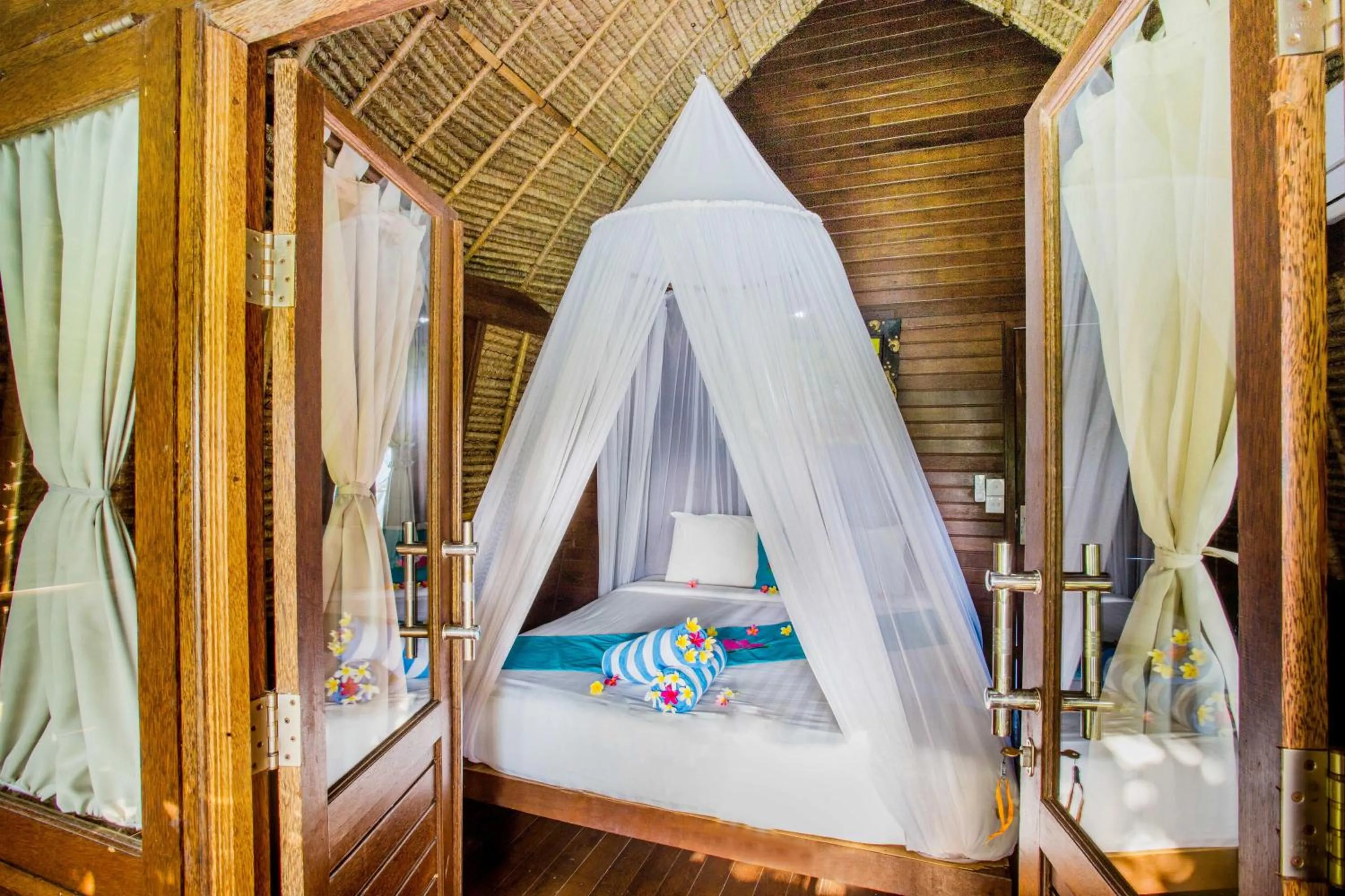 Photo of the whole room, Bed in Lotus Garden Huts