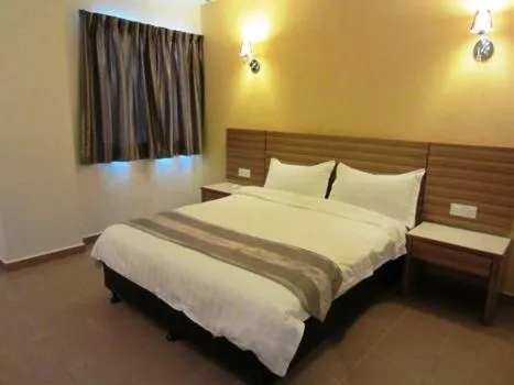 Bed in Grand Court Hotel