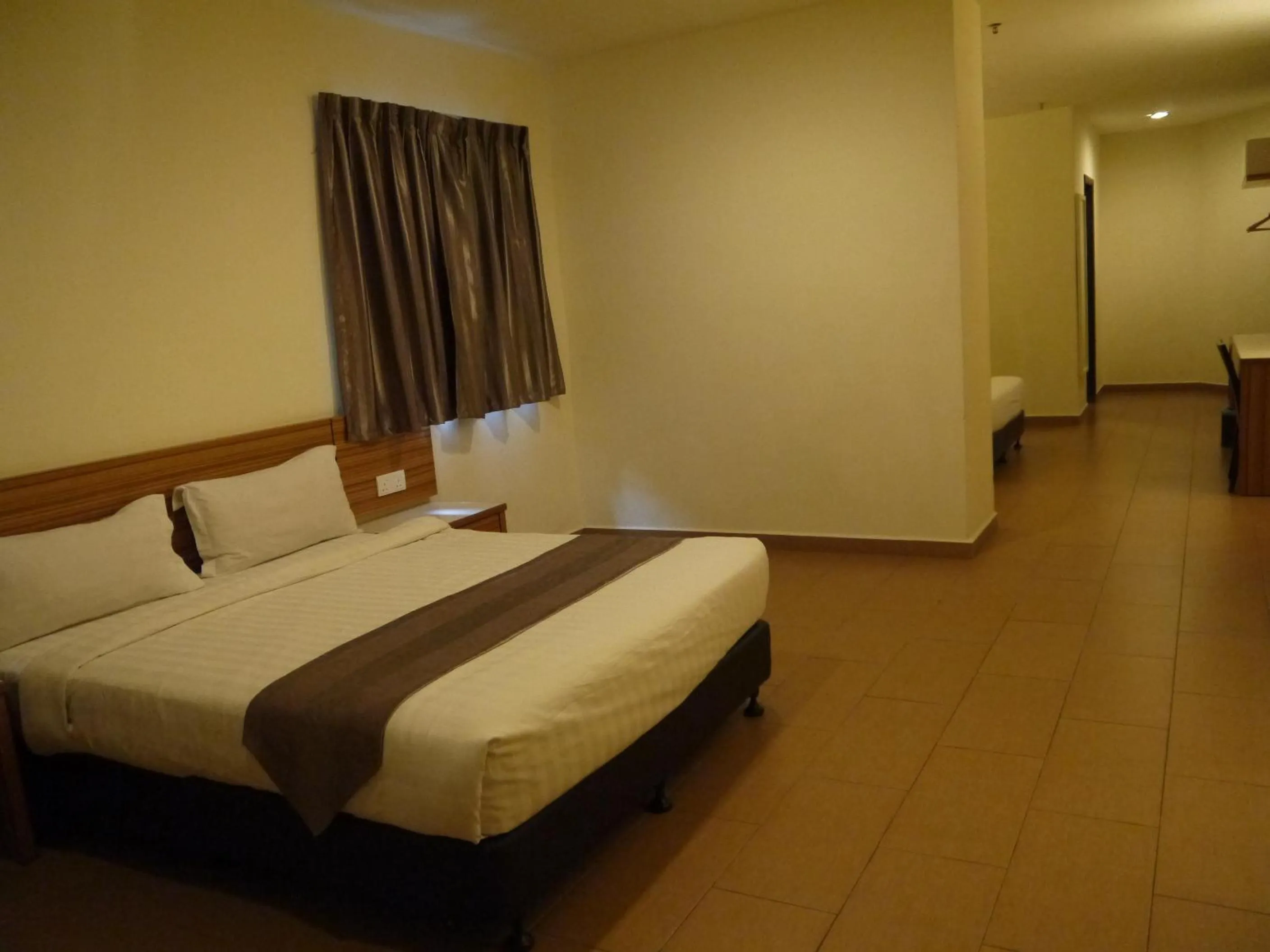 Bed in Grand Court Hotel