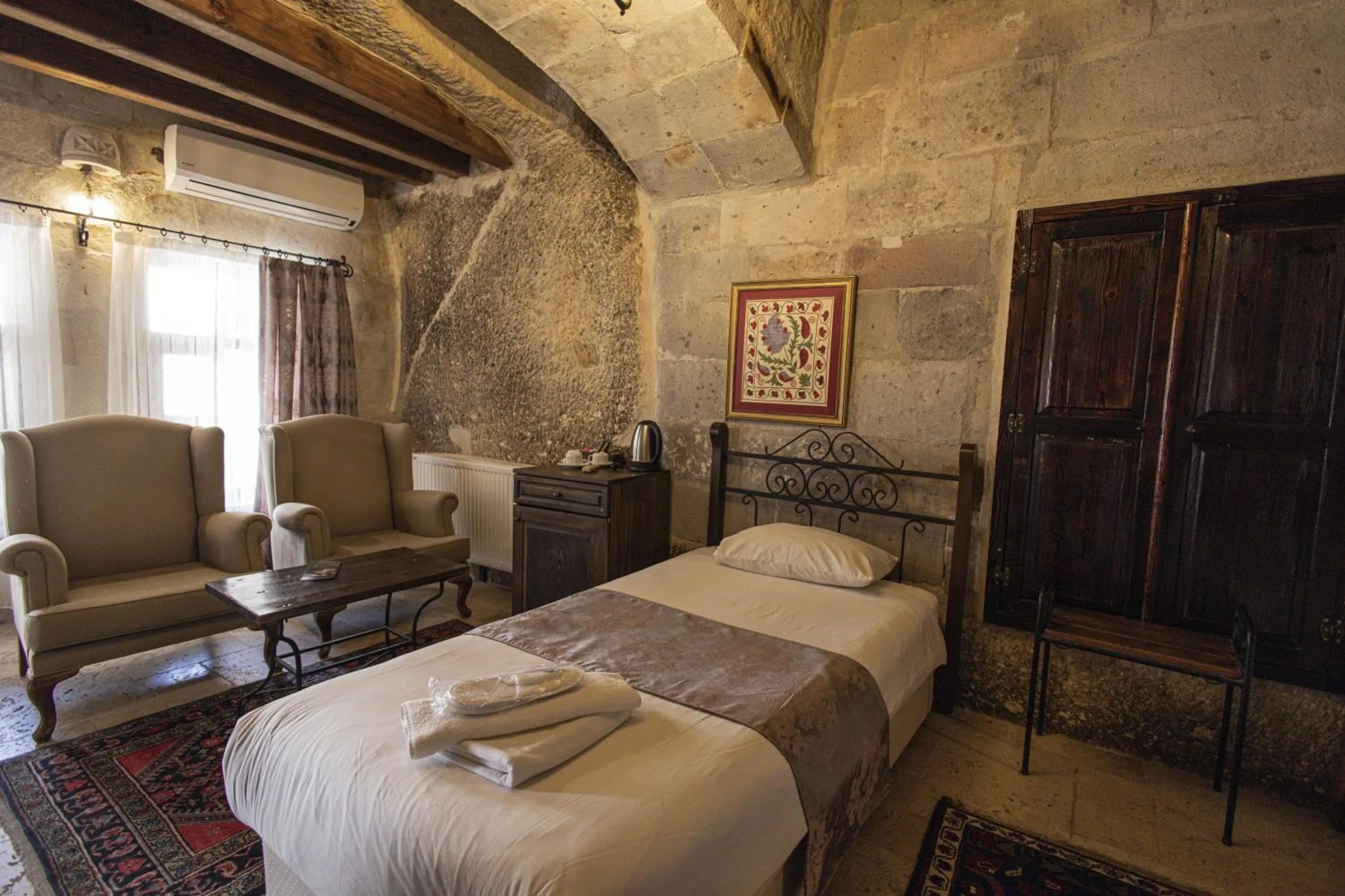 Bed in Century Cave Hotel