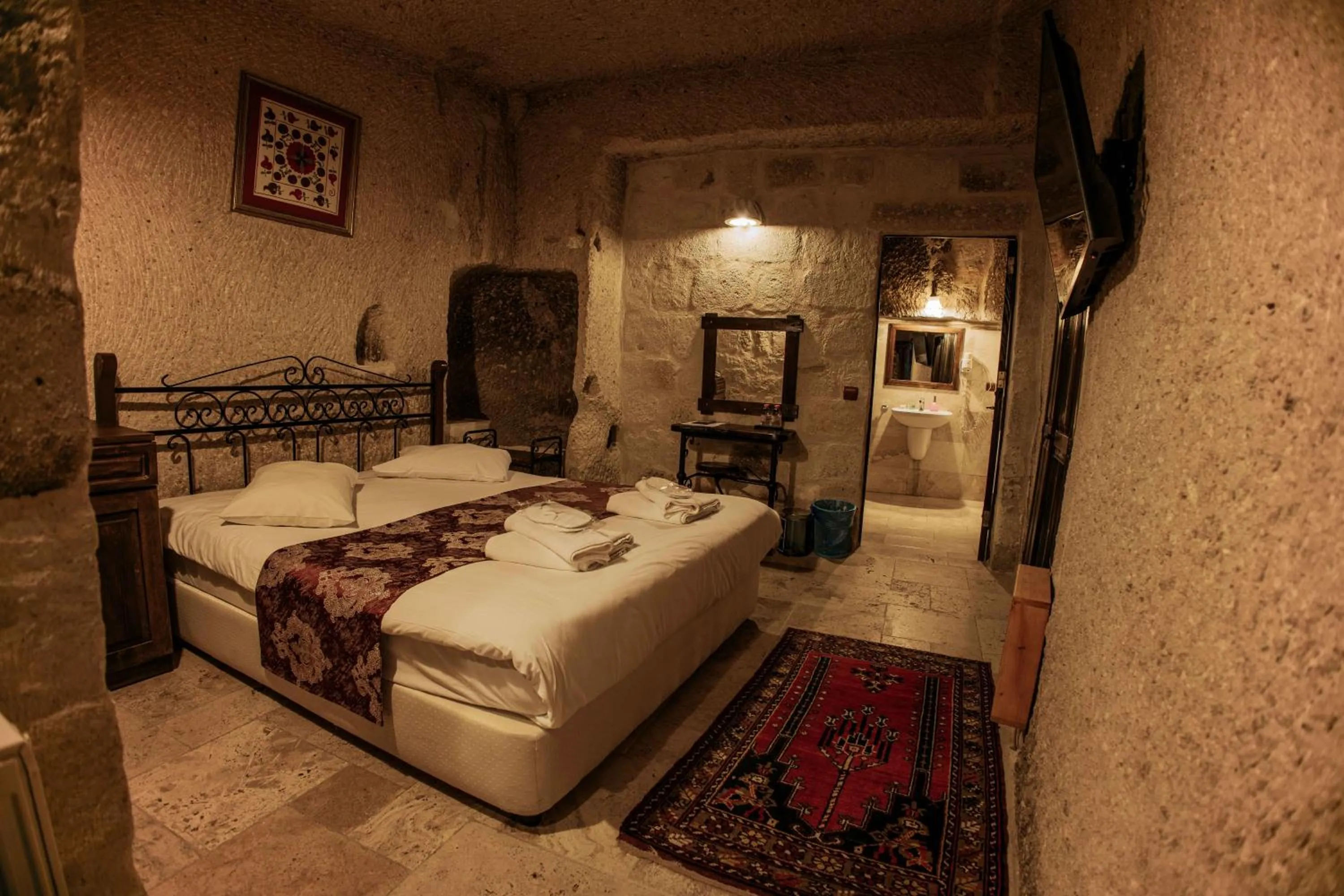 Bed in Century Cave Hotel