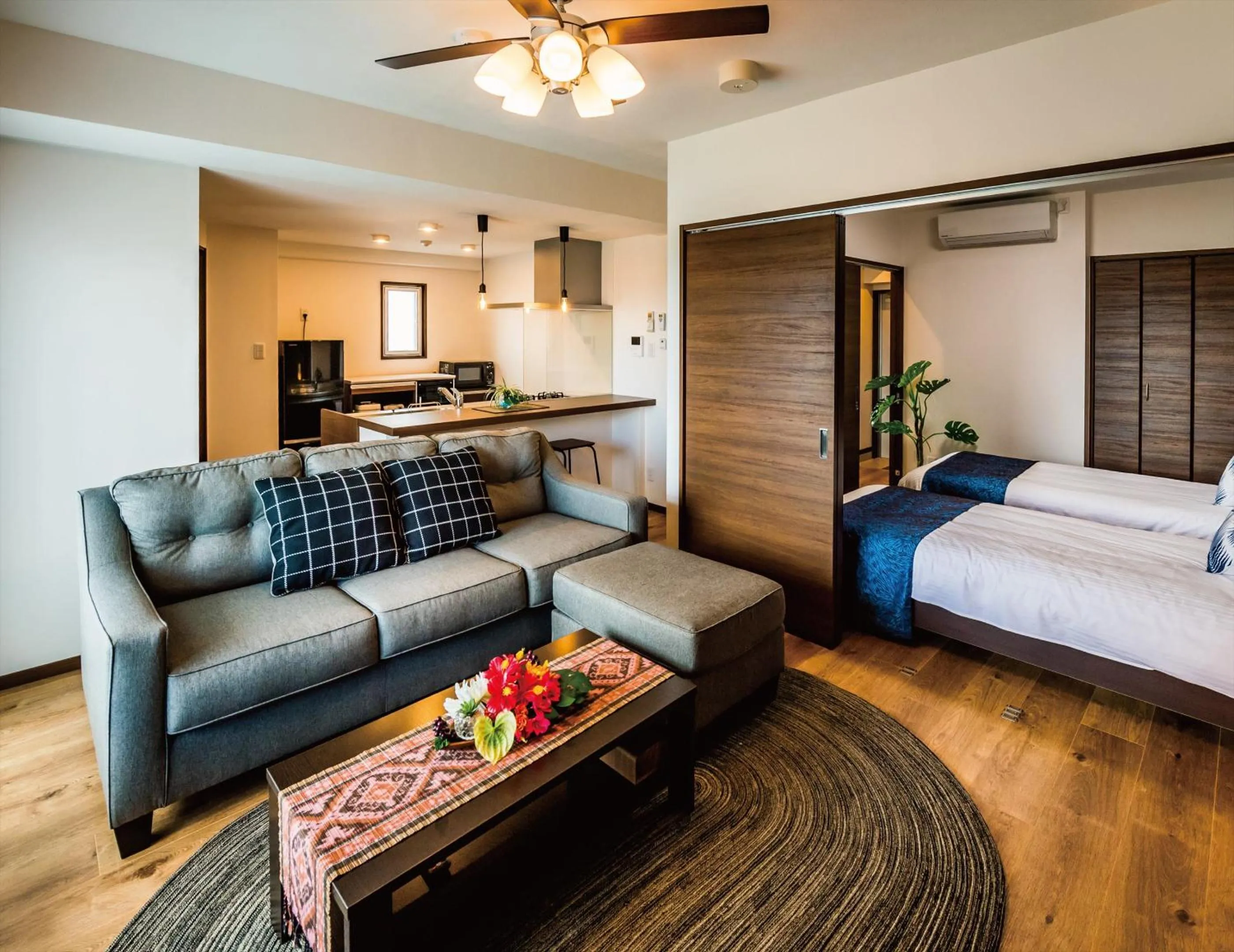 Living room, Bed in Zoe Resort The Sunset Village Okinawa Chatan