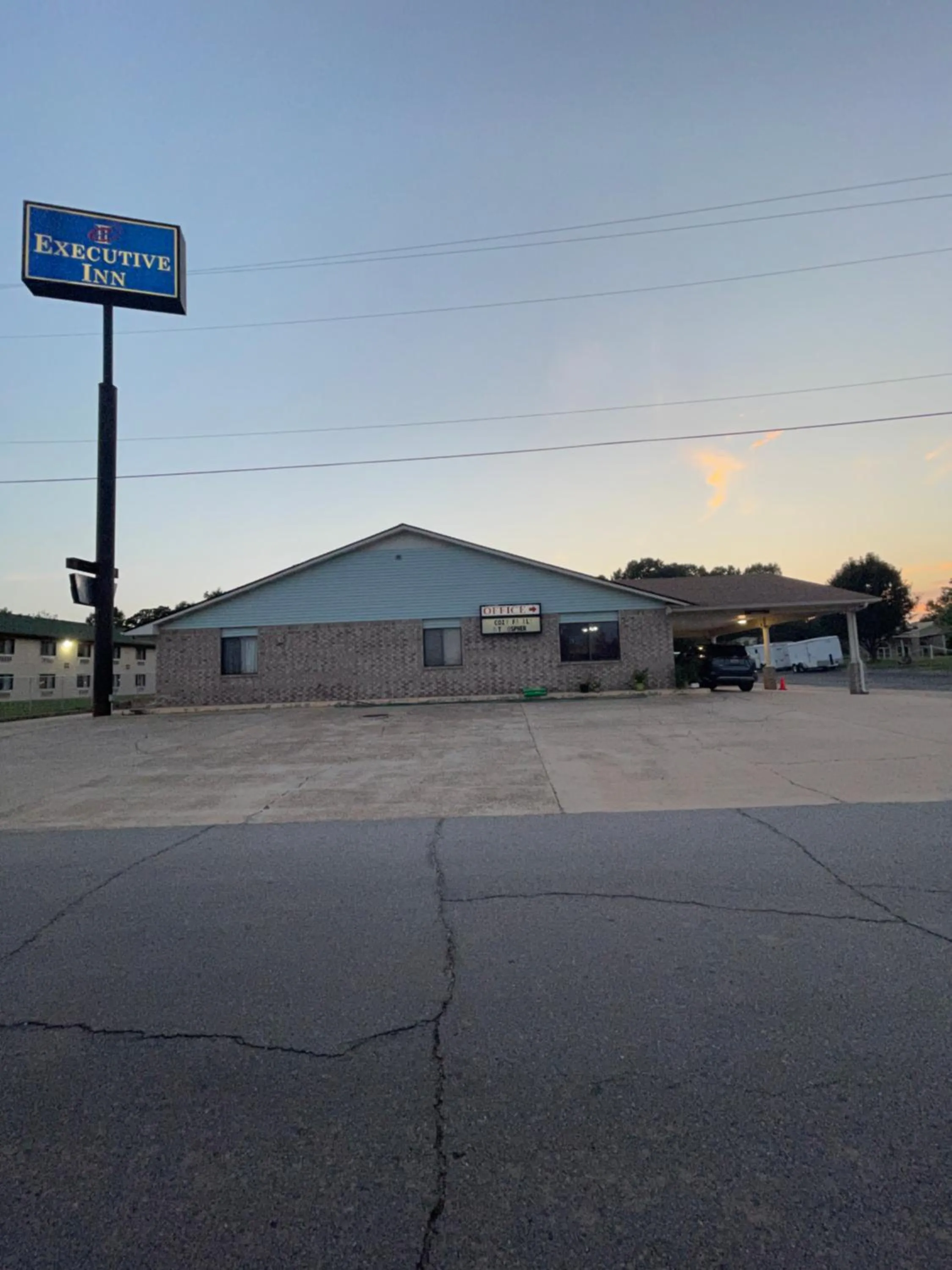 Property logo or sign in Executive Inn
