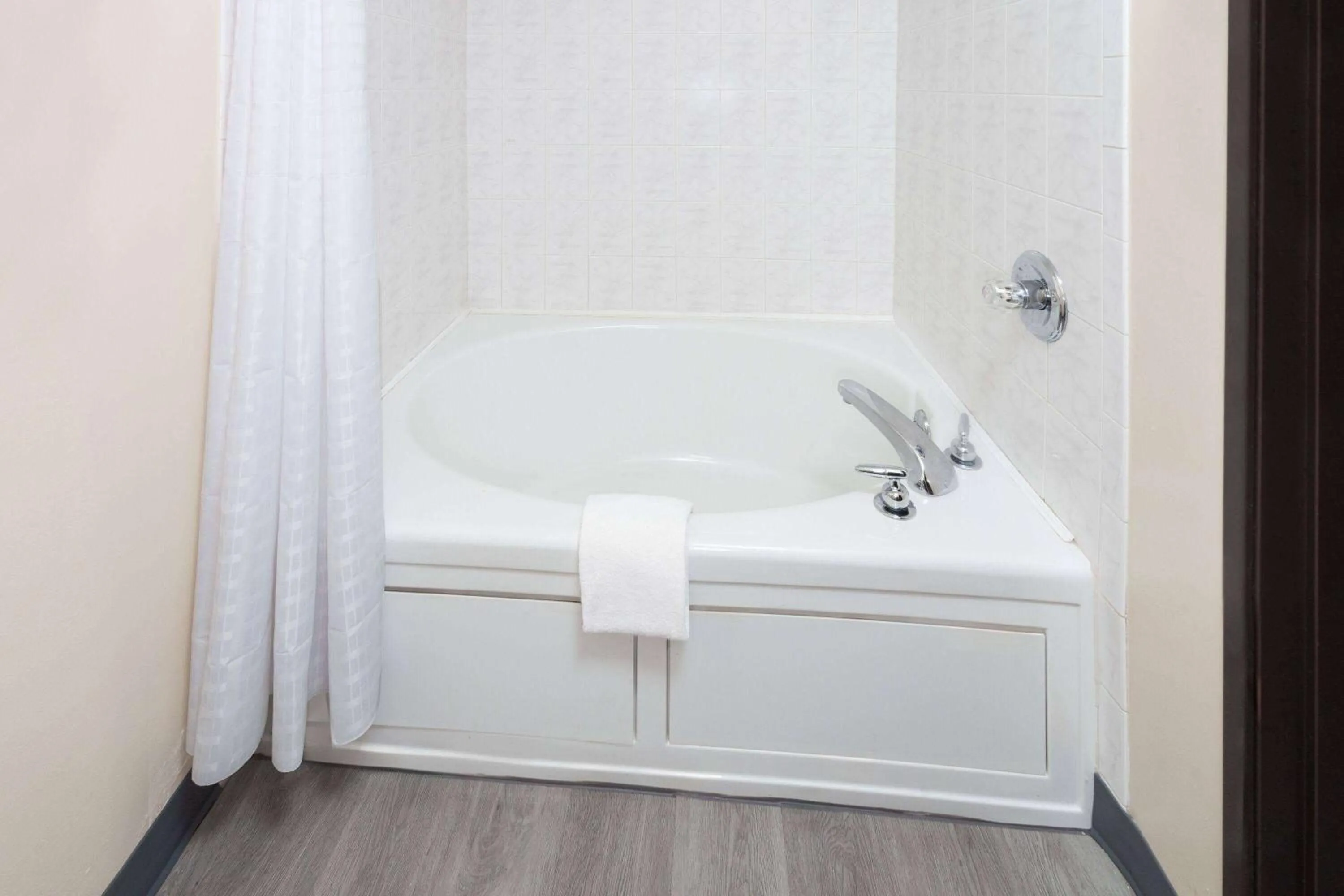 Bathroom in Super 8 by Wyndham McHenry Fox Lake Area