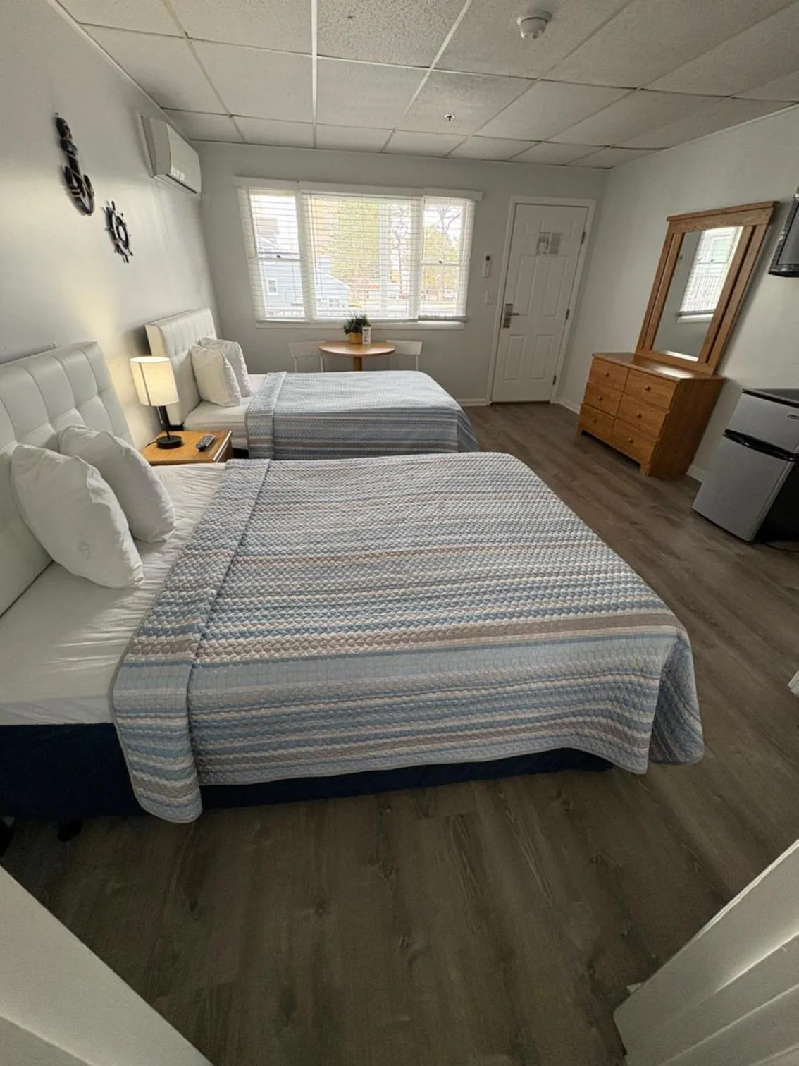 Bed in The Grand Beach Inn