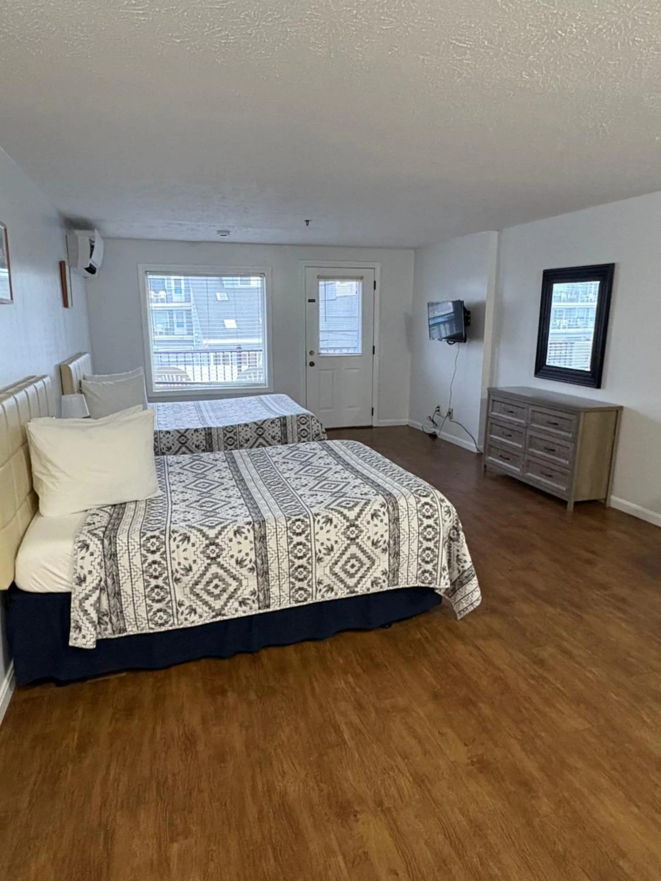 Bed in The Grand Beach Inn