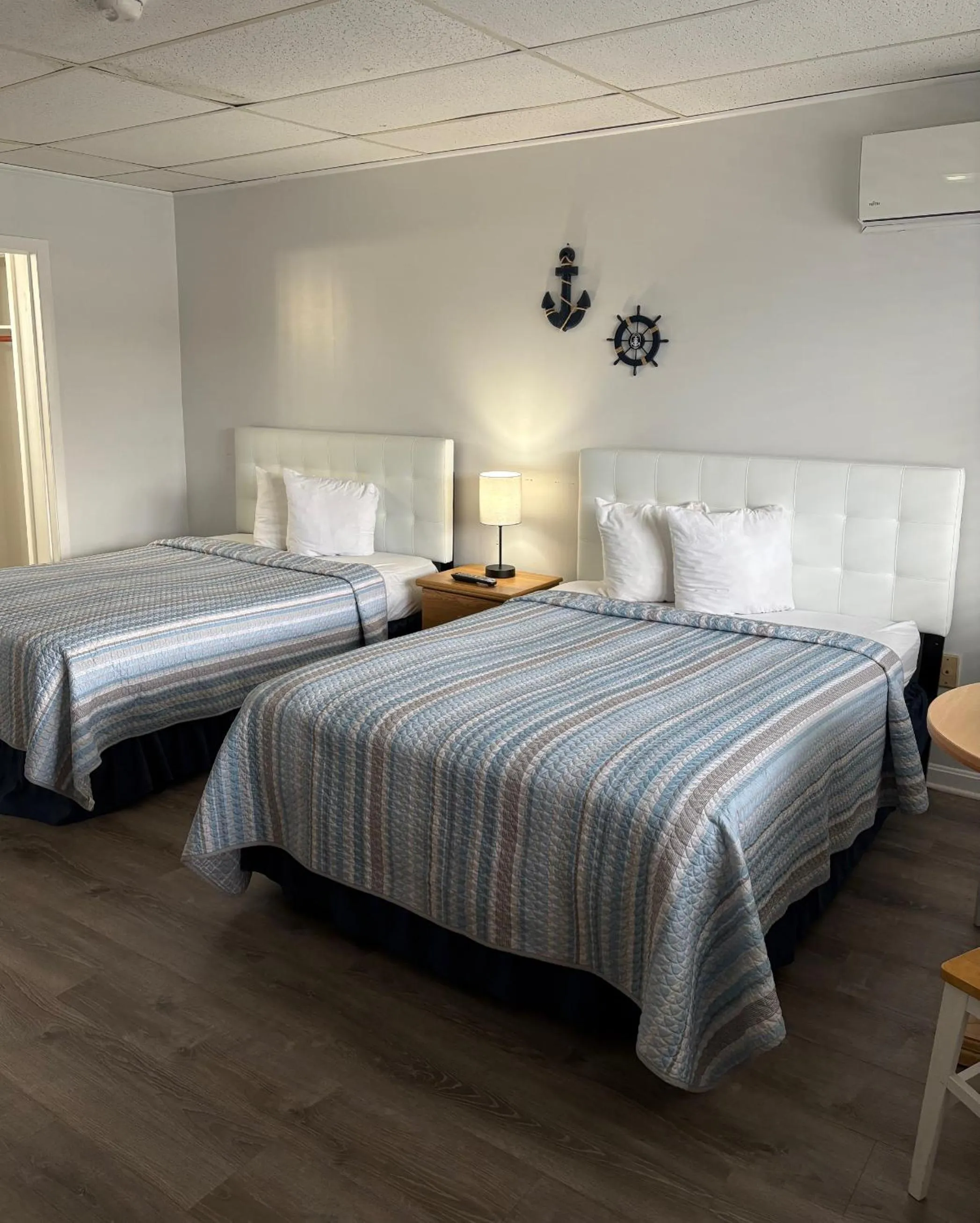 Bed in The Grand Beach Inn