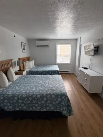 Bed in The Grand Beach Inn