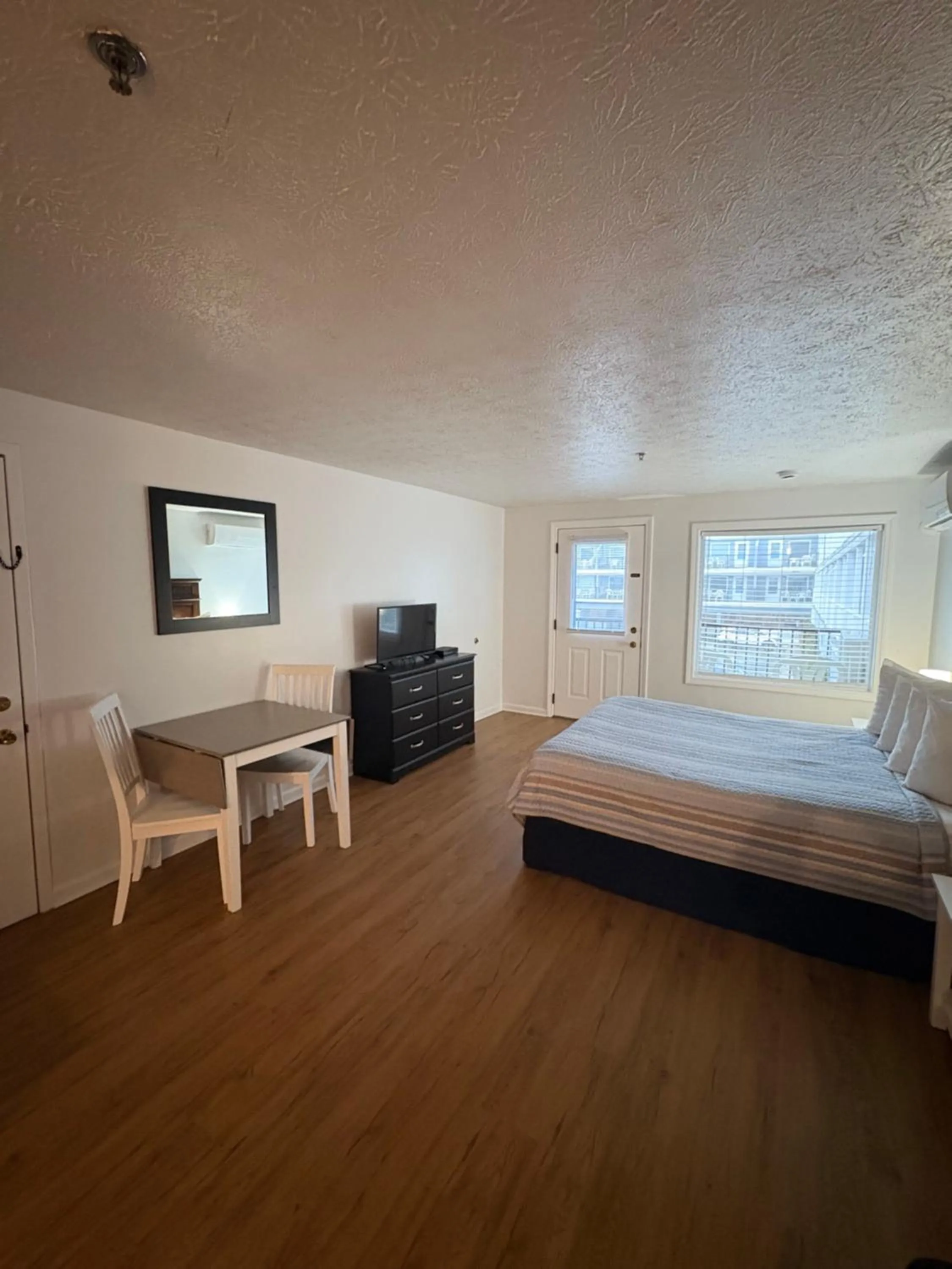 Bed in The Grand Beach Inn