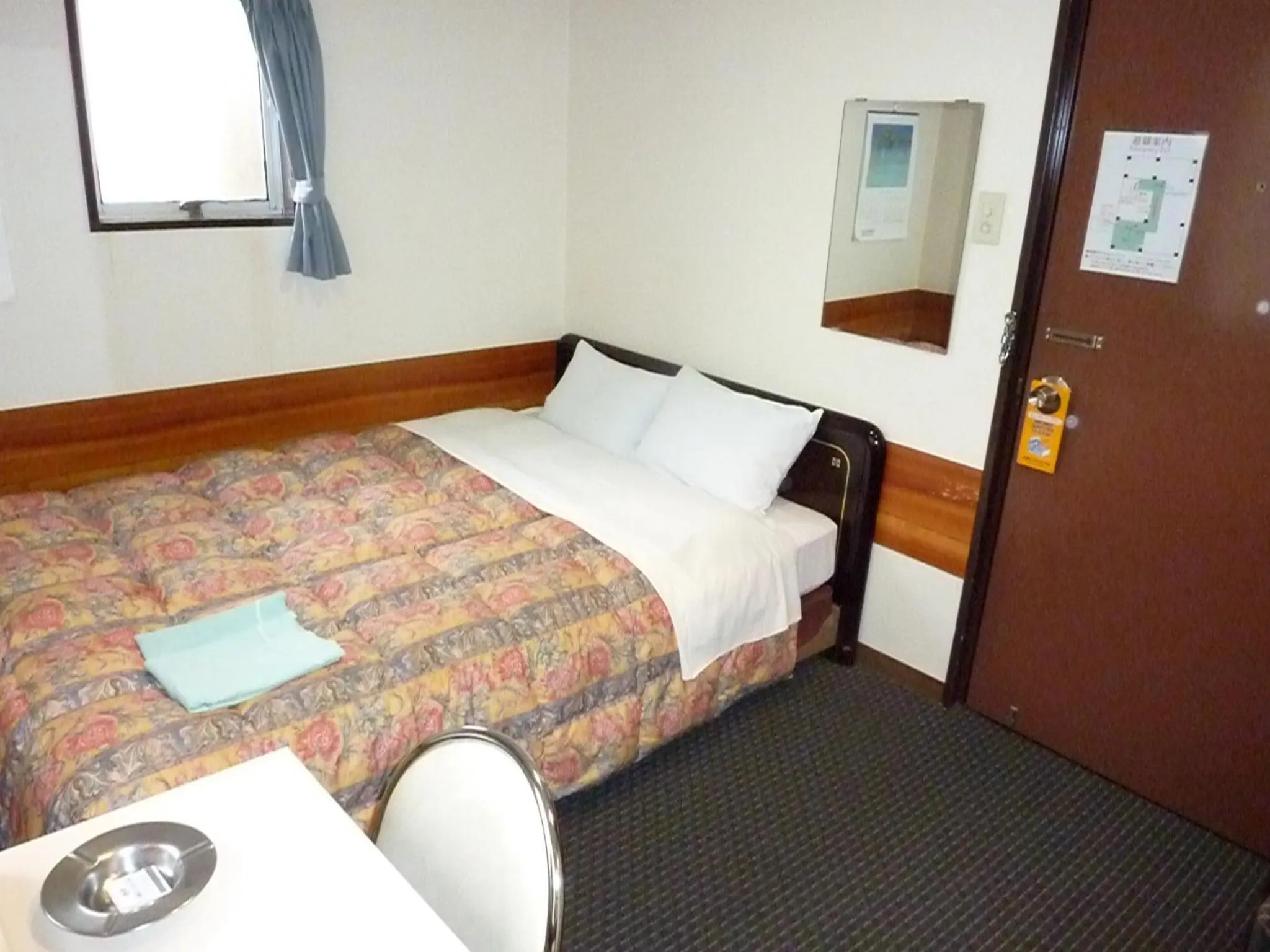 Bed in Otsuka City Hotel