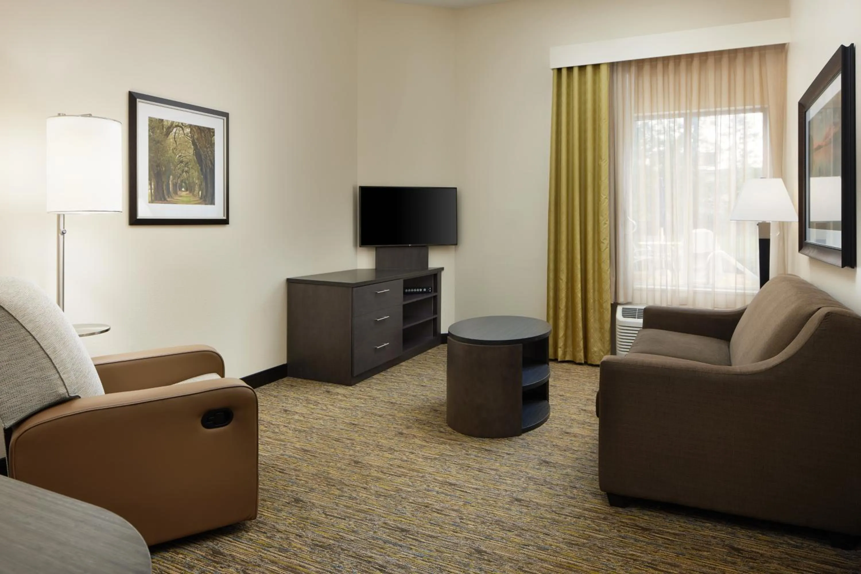 Living room in Candlewood Suites Valdosta Mall by IHG